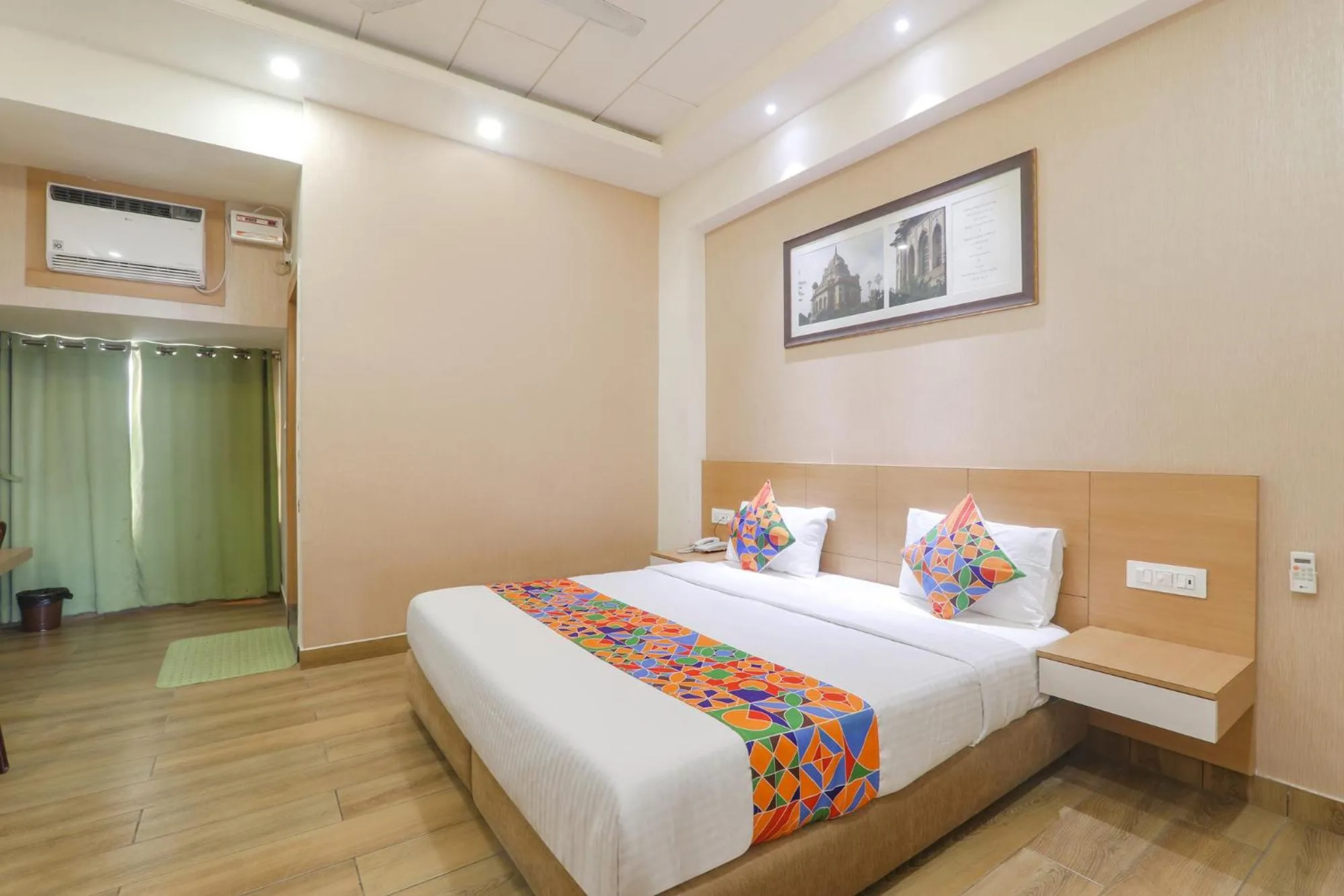 Bed in FabHotel Raghubar Kripa