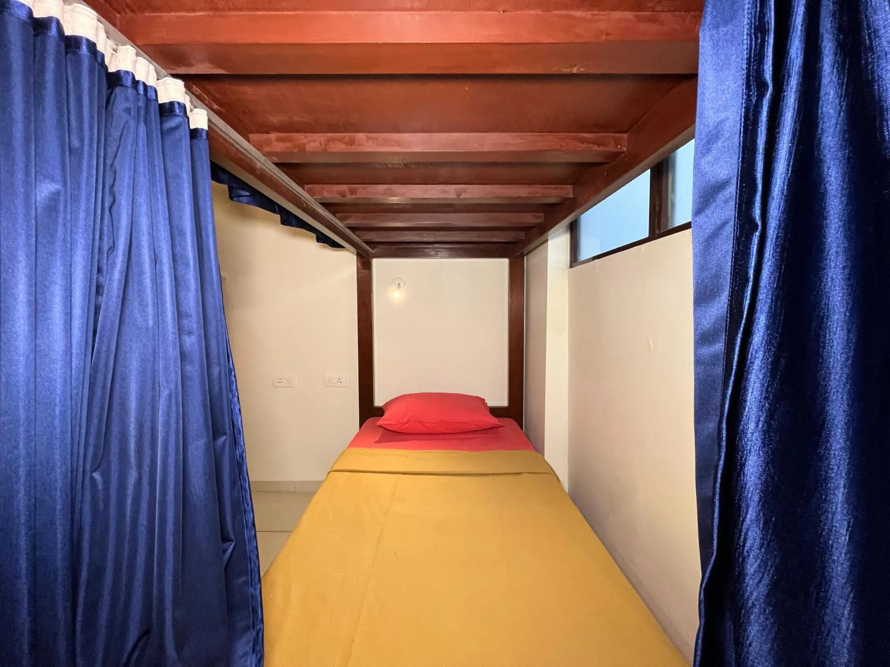 Bed in Bay Stays near white town