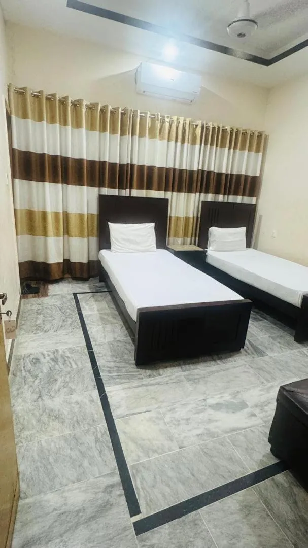 Bed in New Palace Guest House