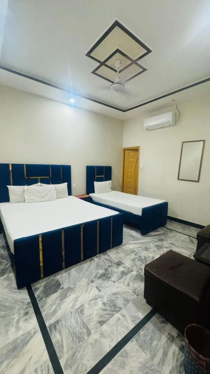 Bed in New Palace Guest House