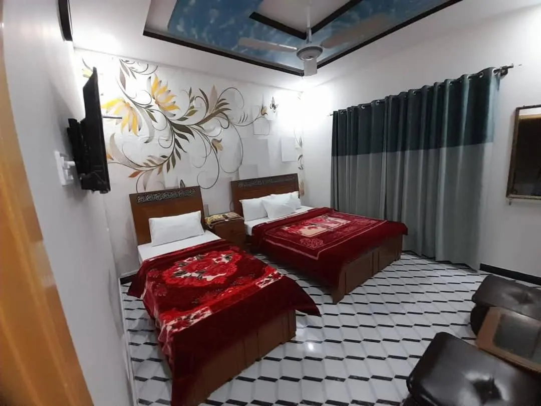 Bed in New Palace Guest House