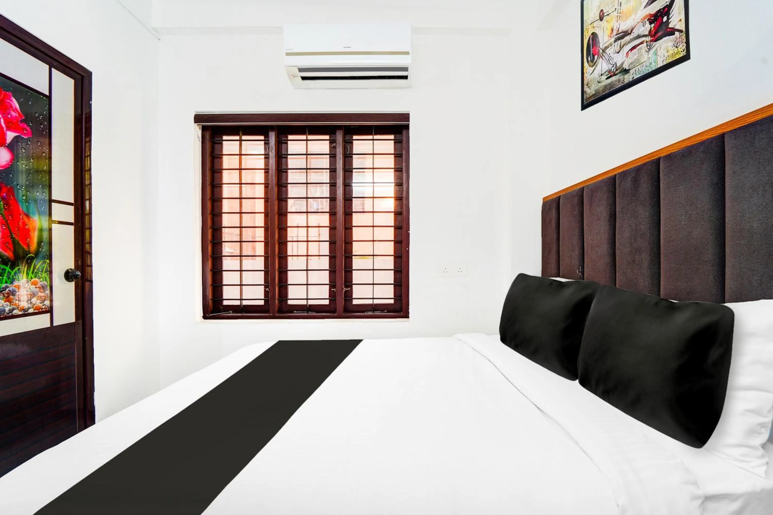 Bedroom, Bed in Super Hotel O Attukal Near Attakulangara Formerly Remya Residency