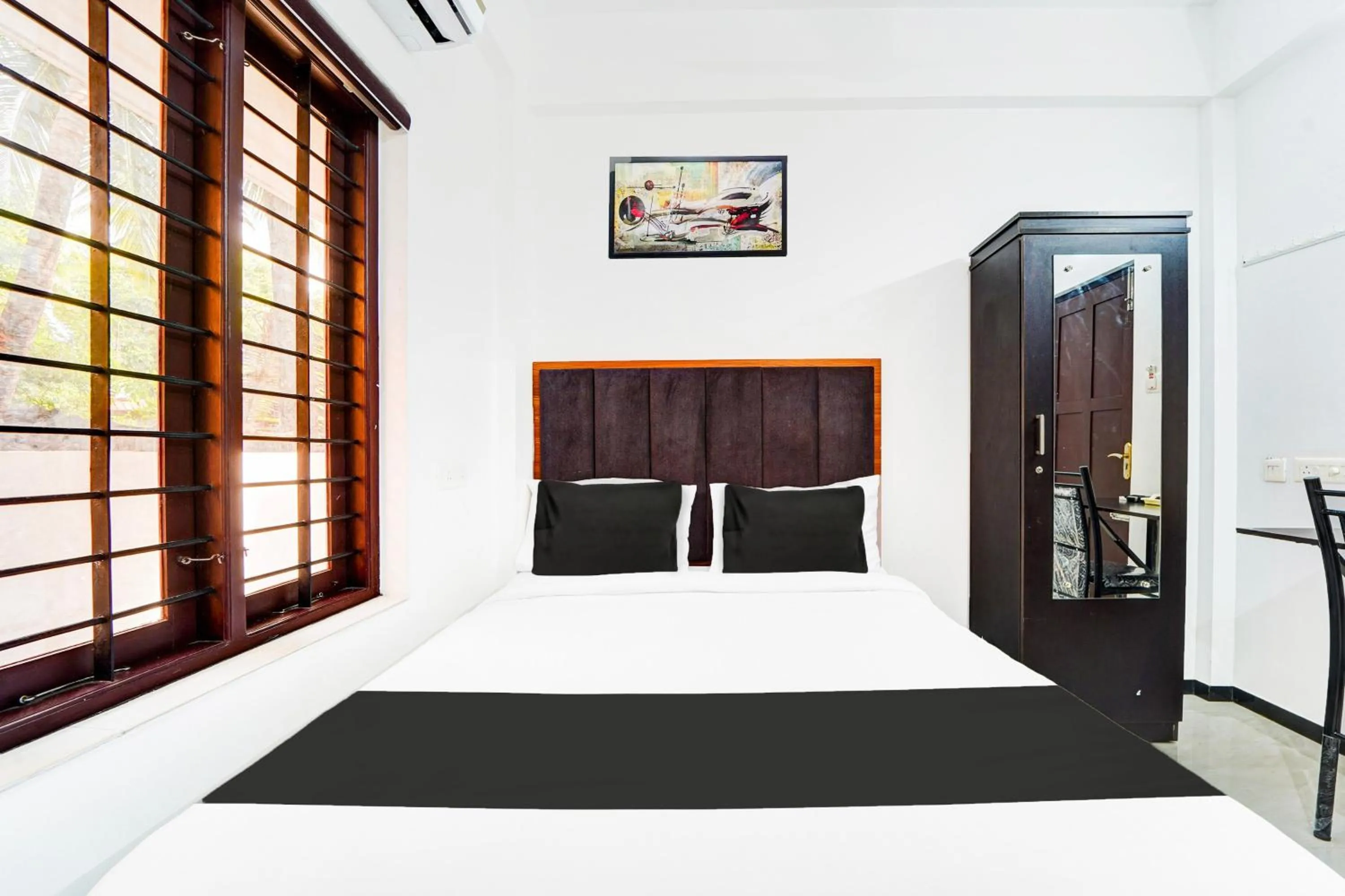 Bedroom, Bed in Super Hotel O Attukal Near Attakulangara Formerly Remya Residency