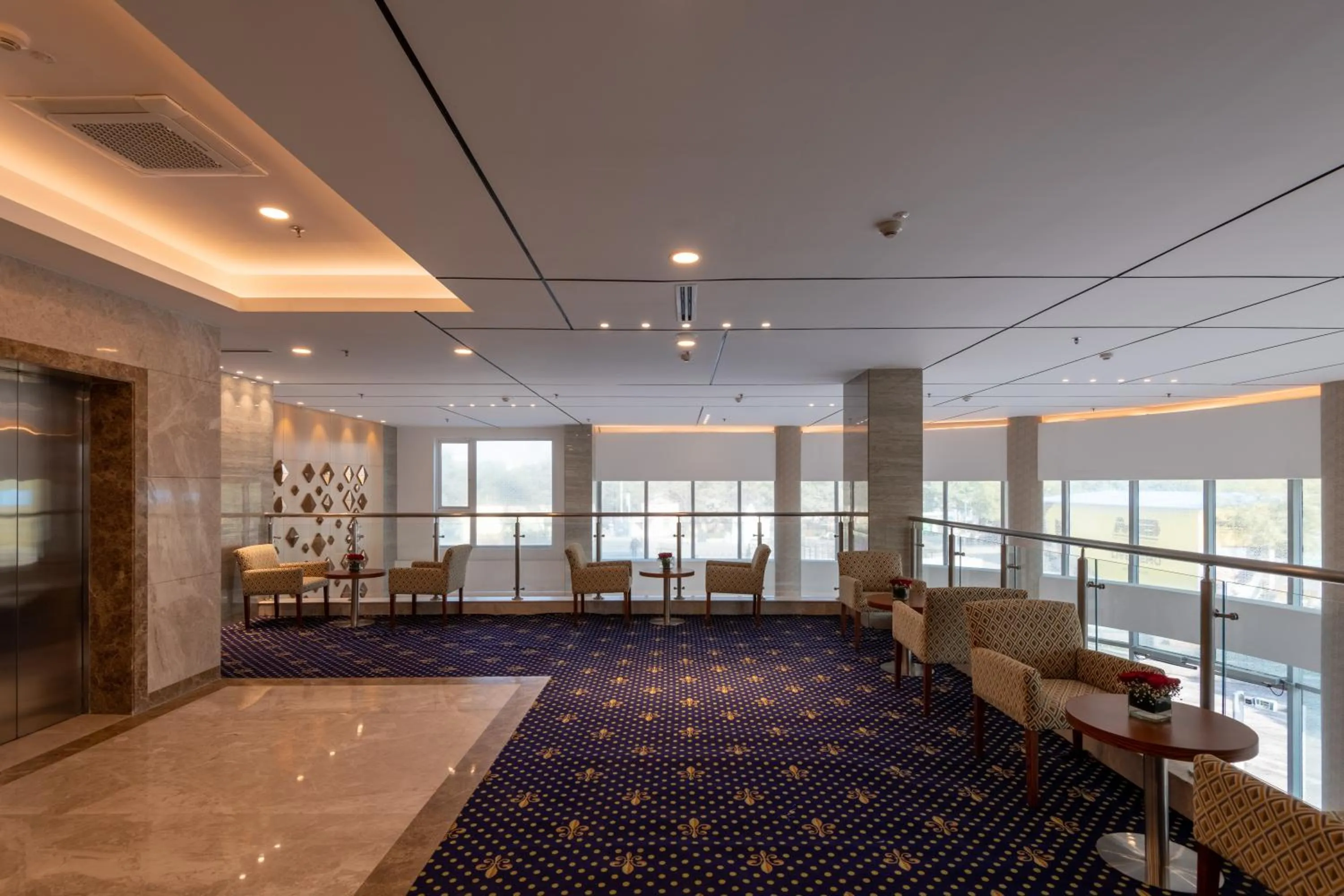 Seating area in ExpoInn Suites and Convention