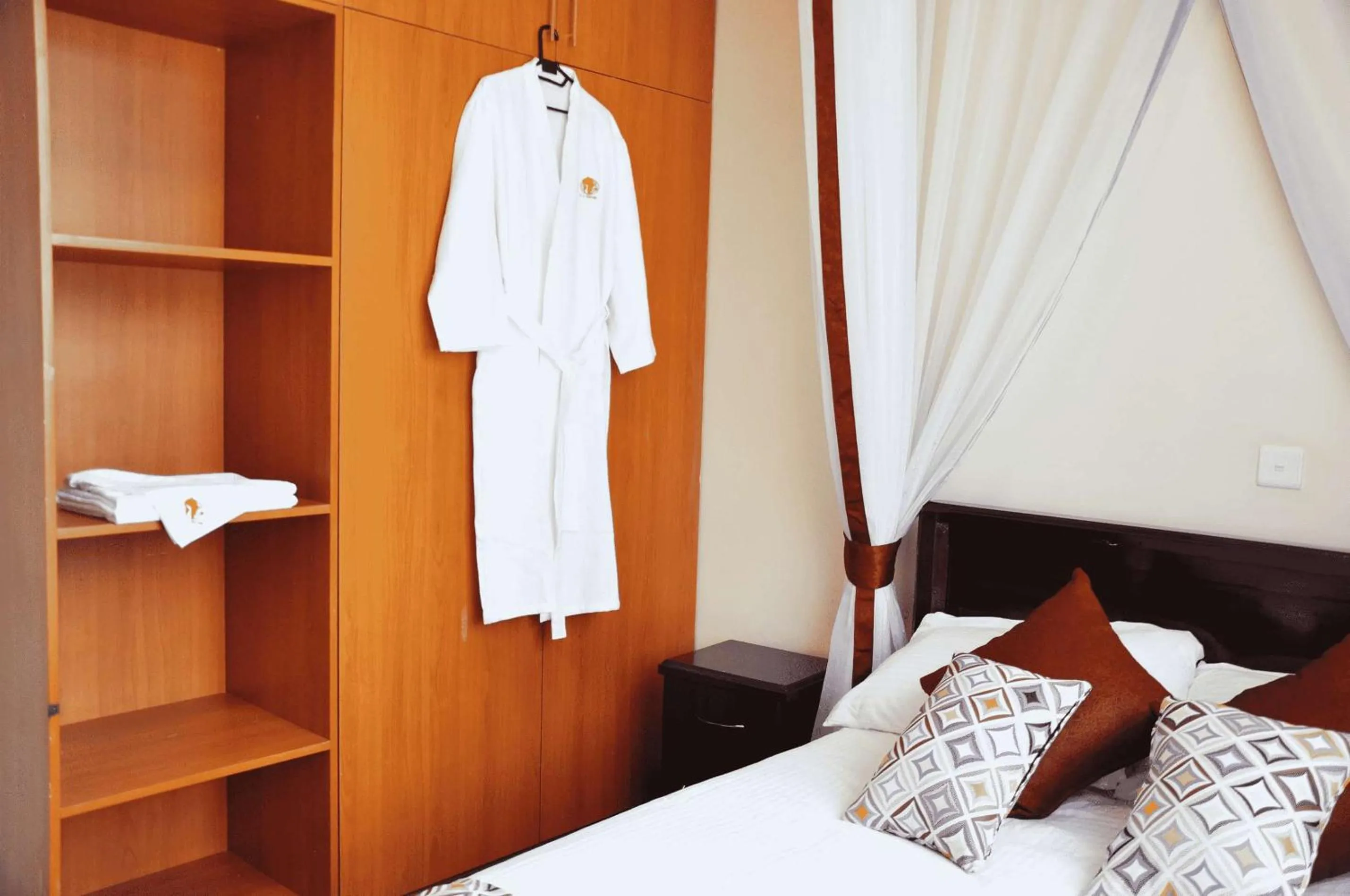 wardrobe, Bed in The Radix Hotel Limited