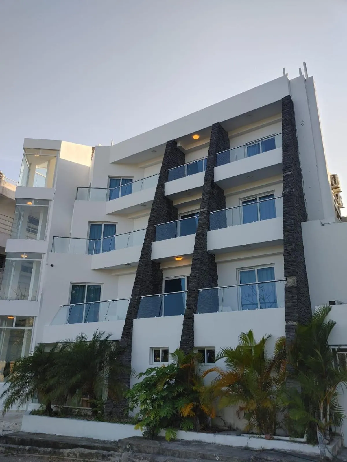 Property building in Samaná Suites Hotel by Habita