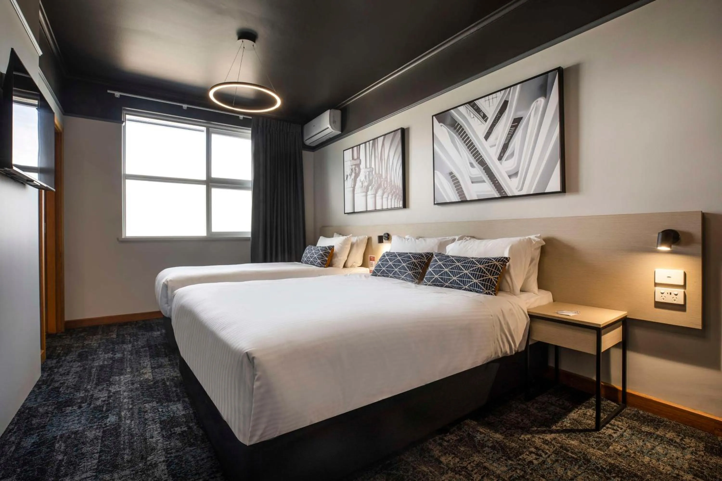 Bedroom, Bed in Nightcap at Empire Hotel