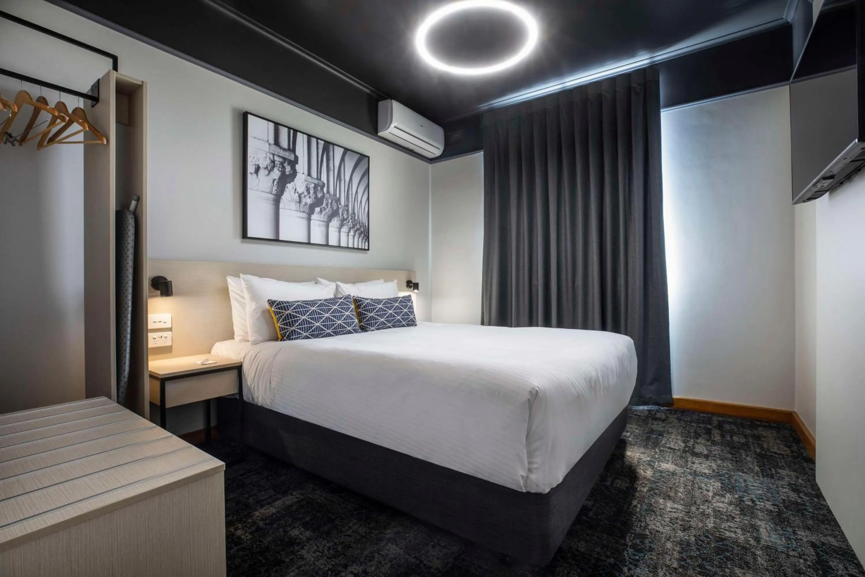 Bedroom, Bed in Nightcap at Empire Hotel