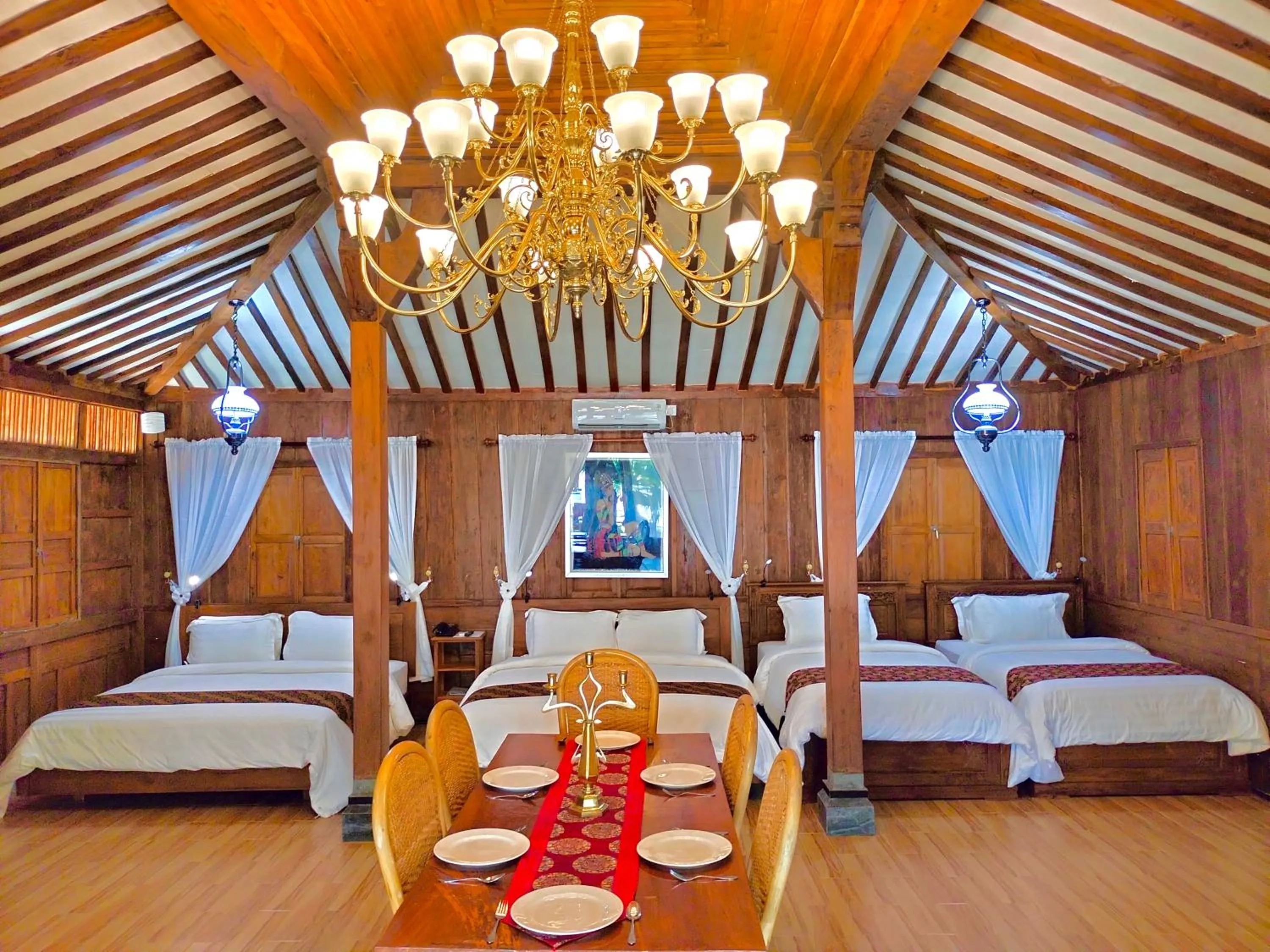 Living room, Bed in Bintan Exotica Resort By Waringin Hospitality