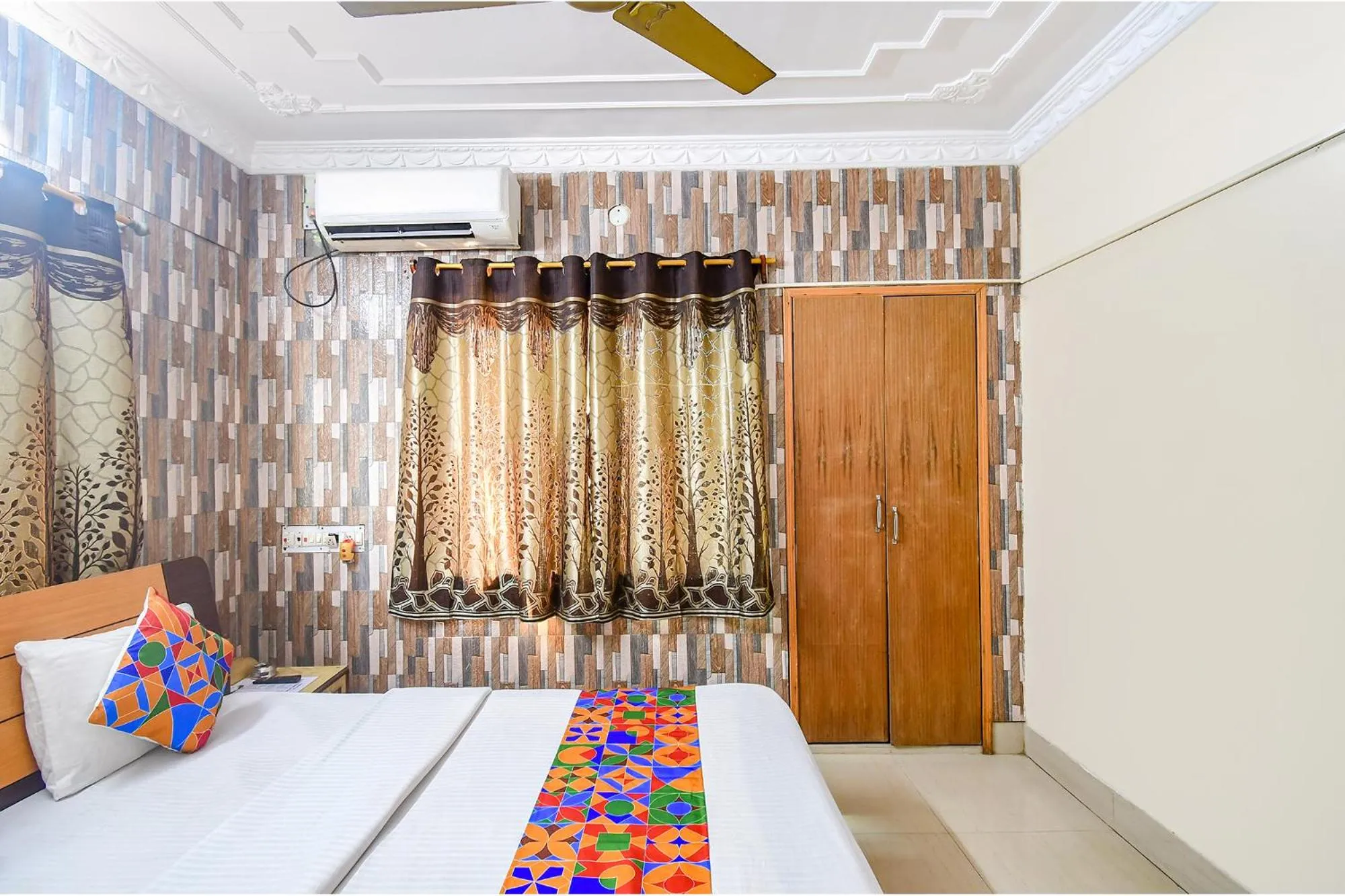 Bed in FabHotel Heritage Inn