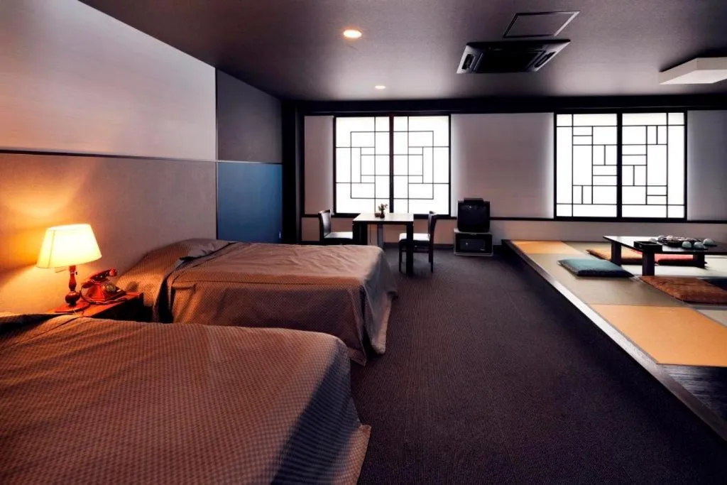 Bed in Hotel Seiryu Japanese Spa inn with spectacular view in Osaka