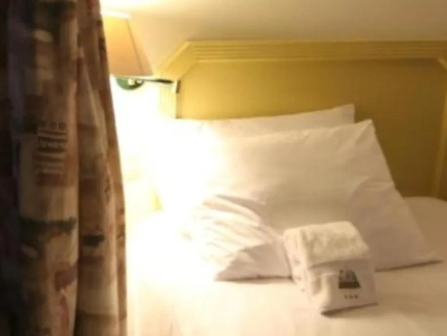 Bed in Plaza Mayor Hotel