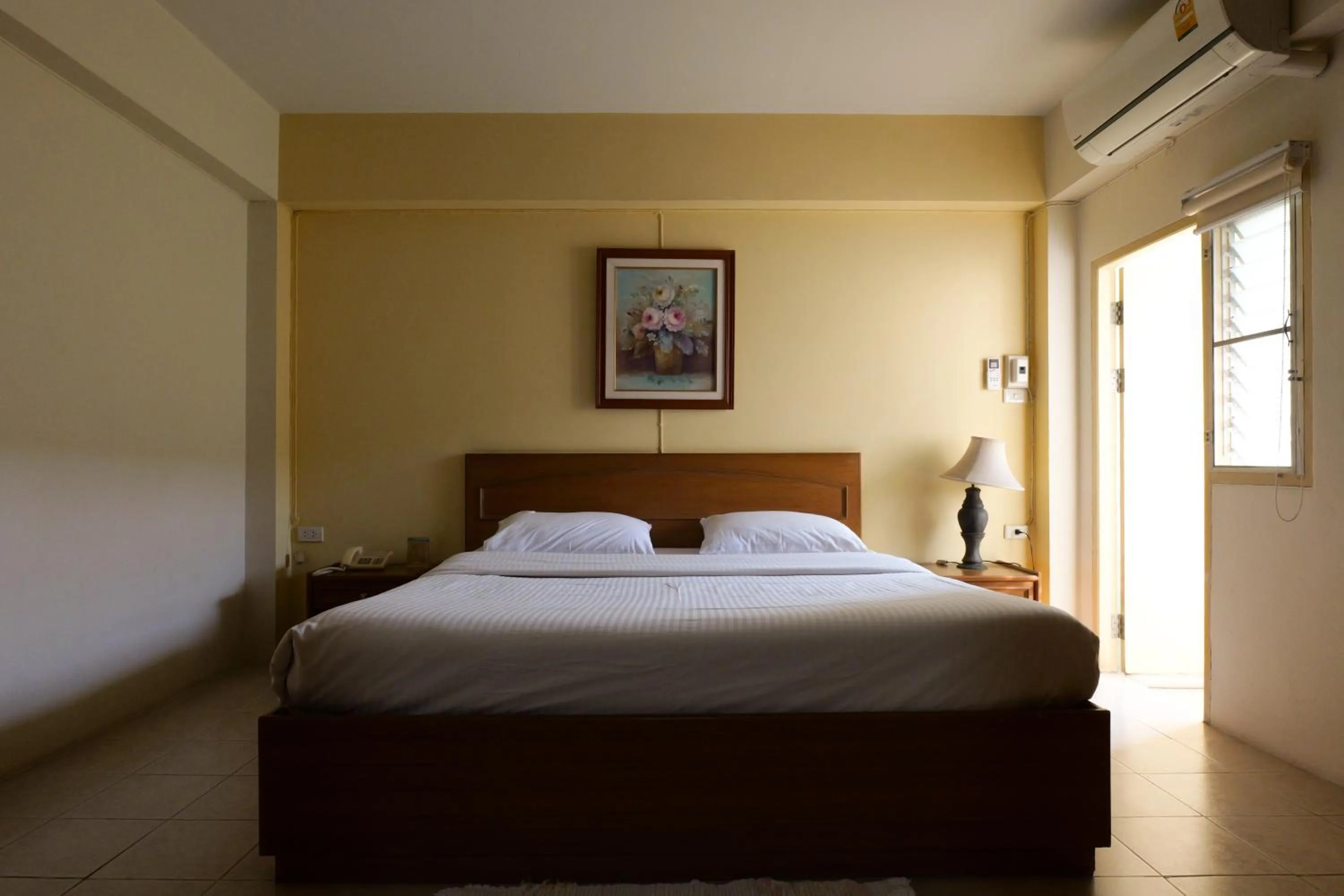 Bed in โรงแรมมูนแอนด์ซัน Moon and Sun Hotel