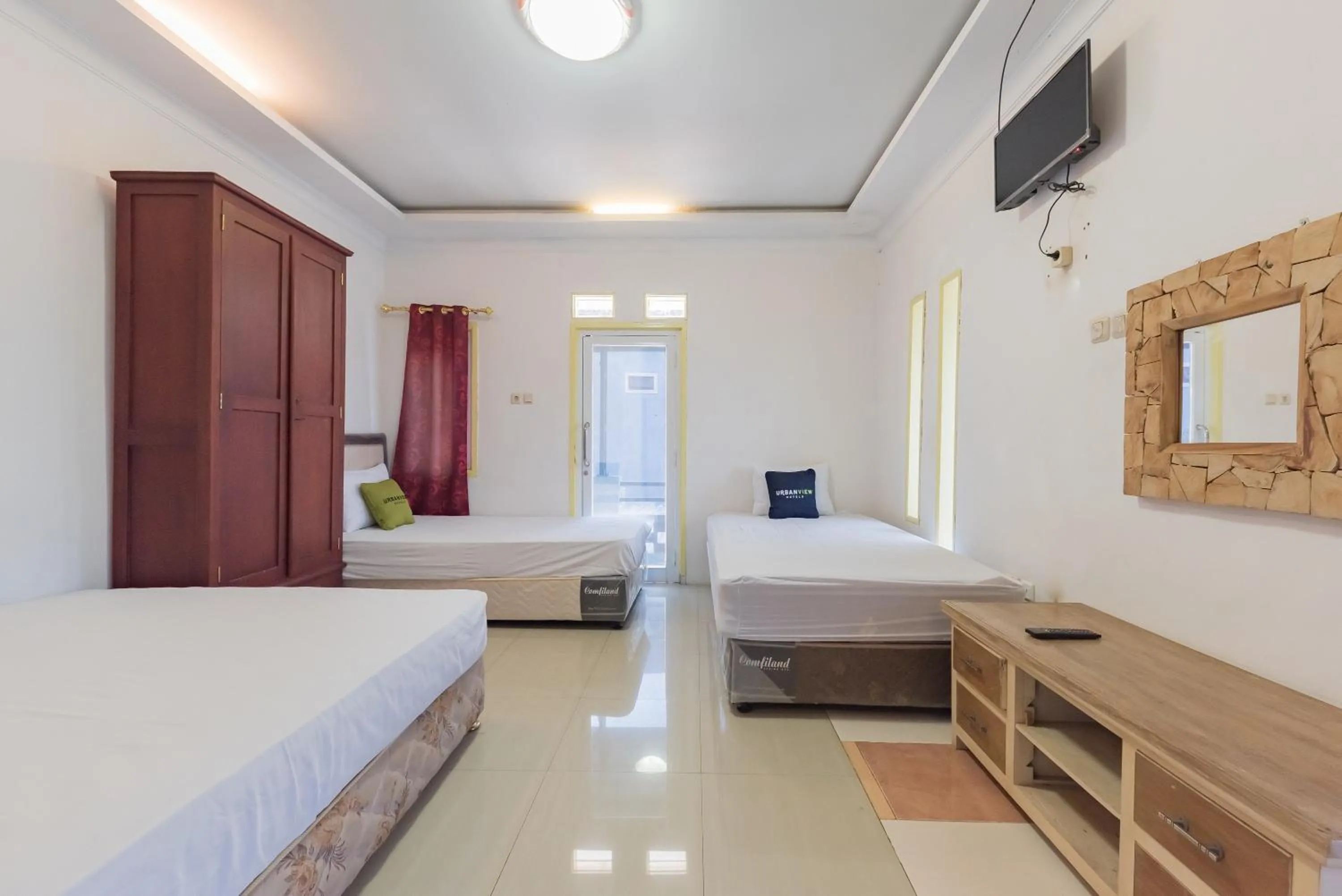 Bed in Urbanview Hotel Anggrek Puncak by RedDoorz