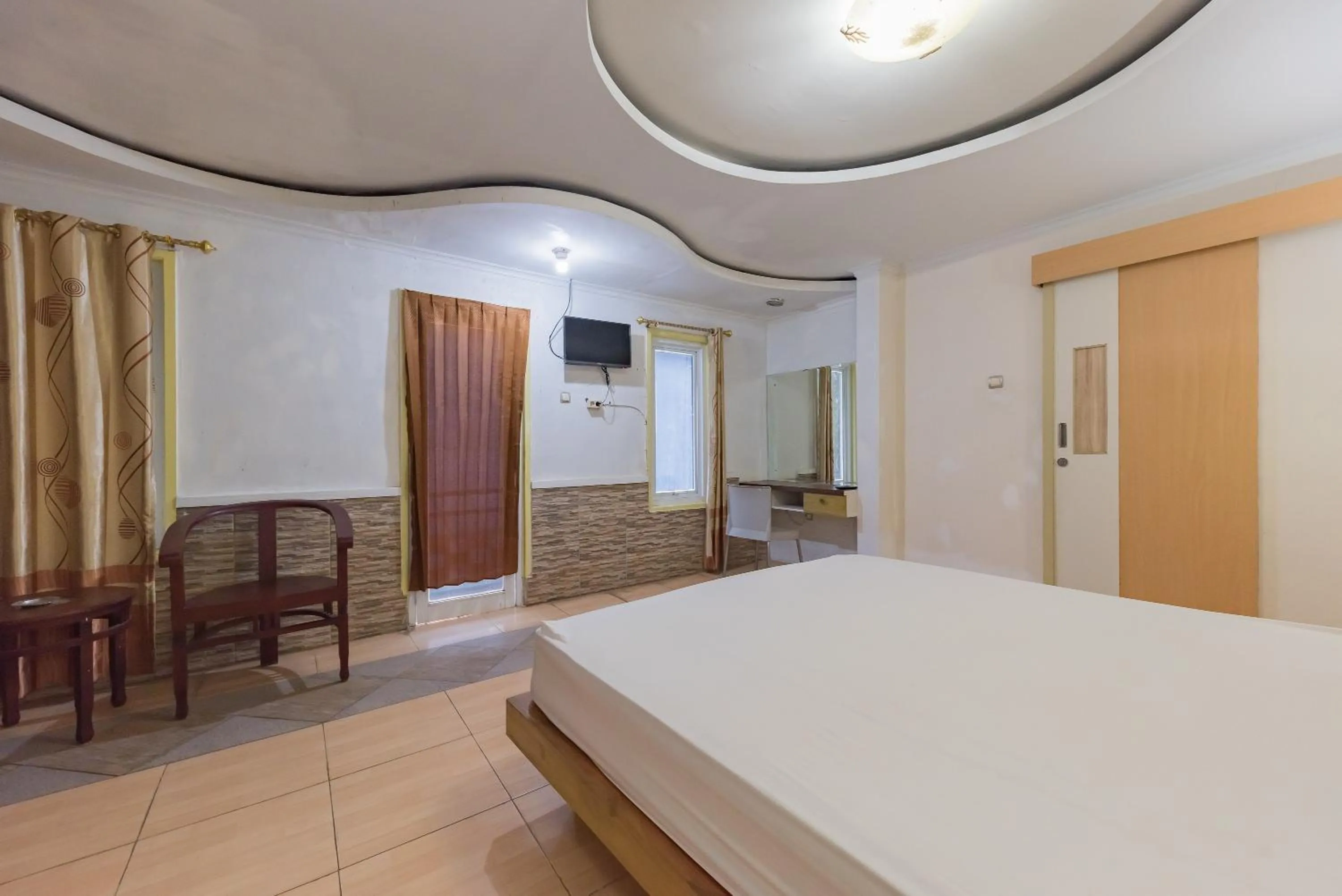 Bed in Urbanview Hotel Anggrek Puncak by RedDoorz