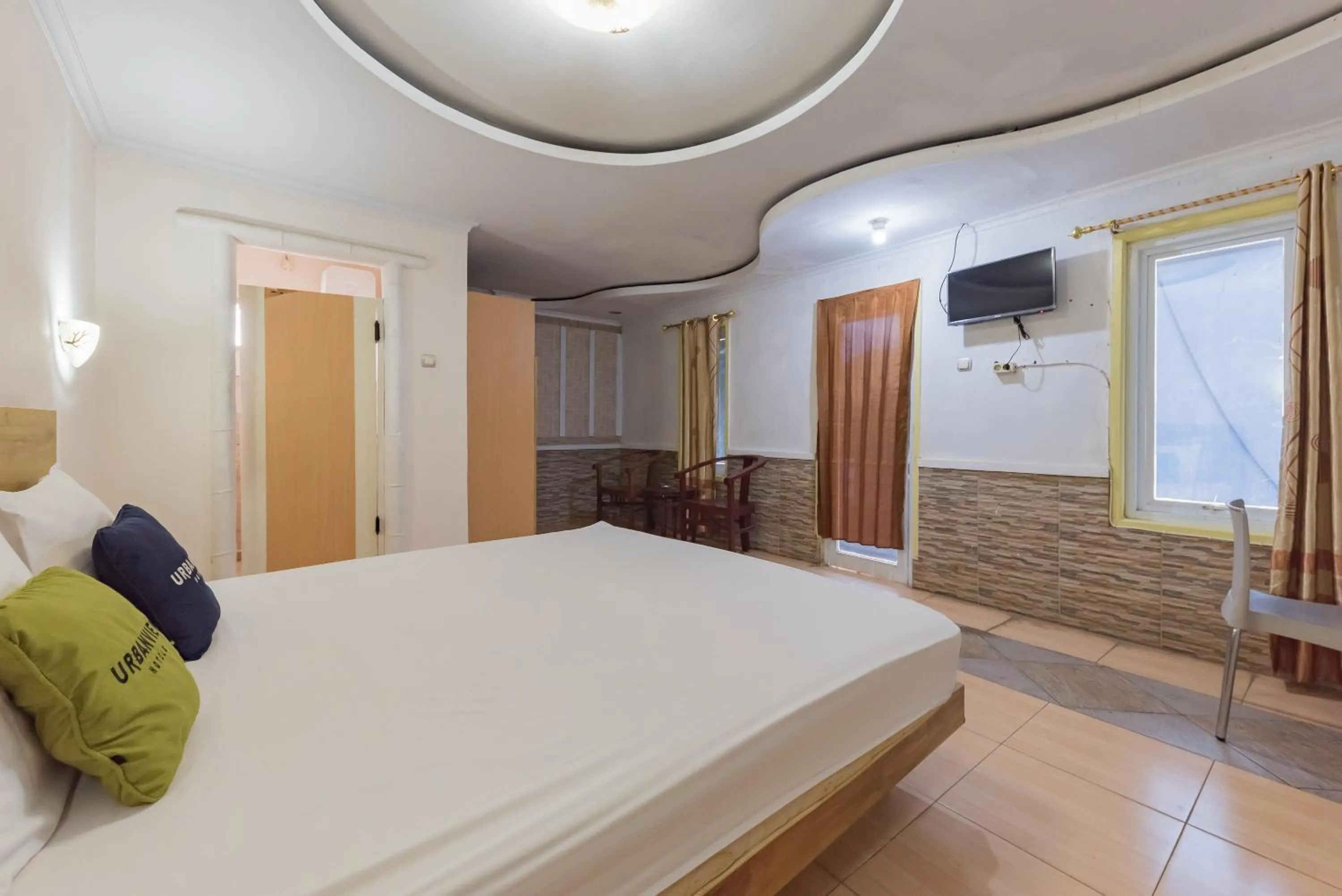 Bed in Urbanview Hotel Anggrek Puncak by RedDoorz