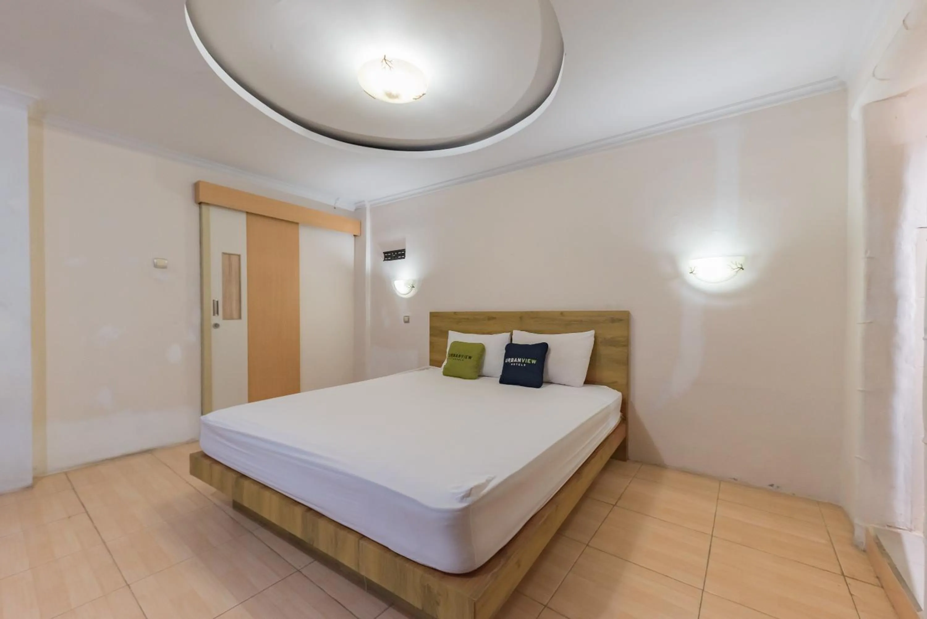 Bed in Urbanview Hotel Anggrek Puncak by RedDoorz