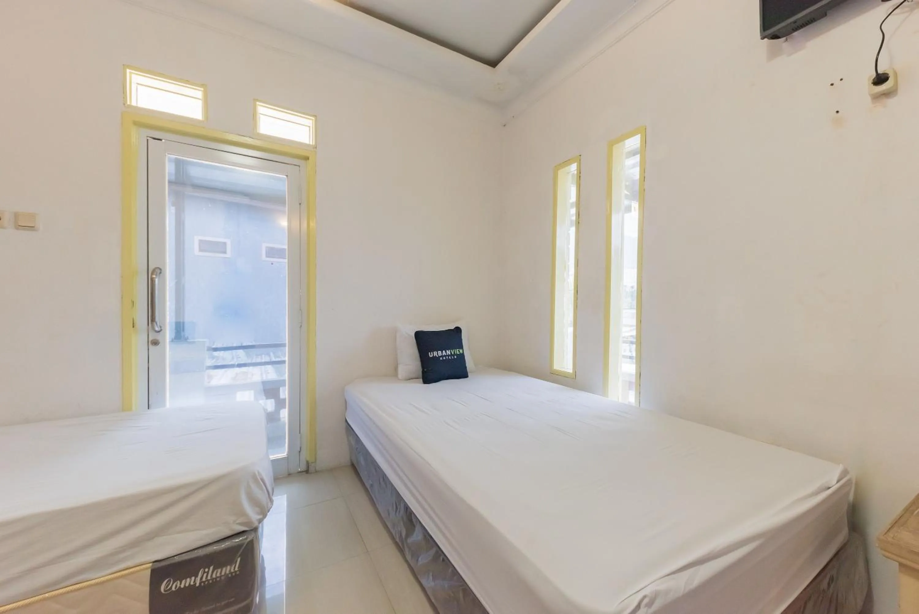 Bed in Urbanview Hotel Anggrek Puncak by RedDoorz