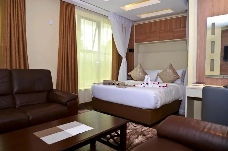 Seating area, Bed in Hylise Hotel