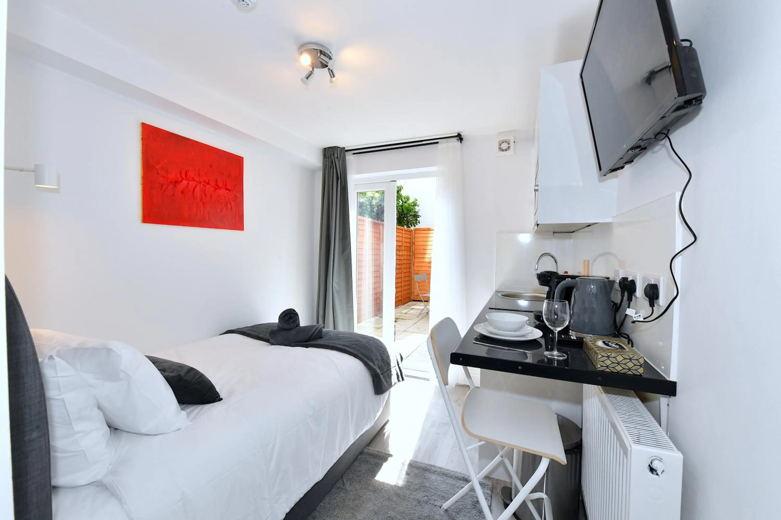 Dining area, Bed in Stylish Studios by Luxestays Fulham