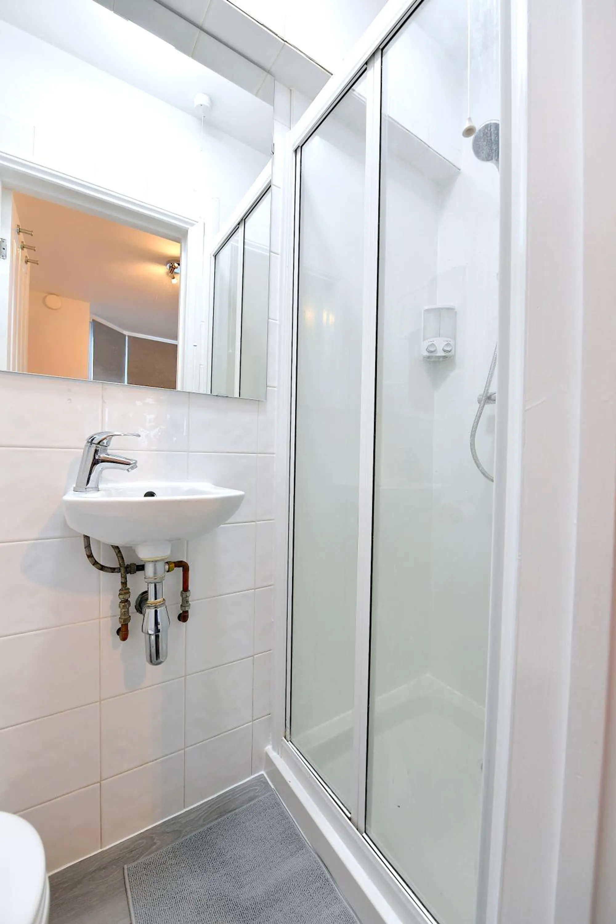 Shower in Stylish Studios by Luxestays Fulham