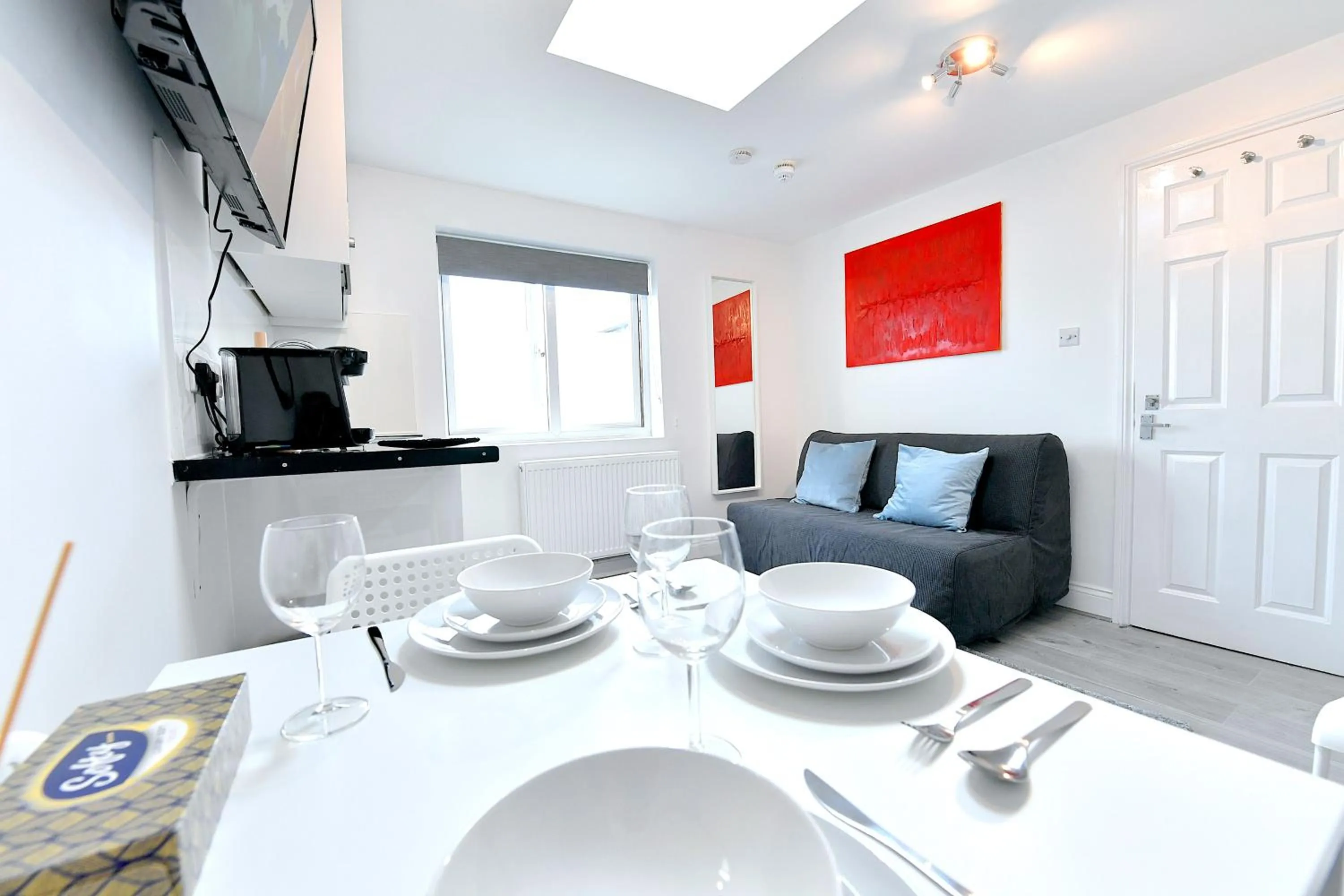 Seating area in Stylish Studios by Luxestays Fulham