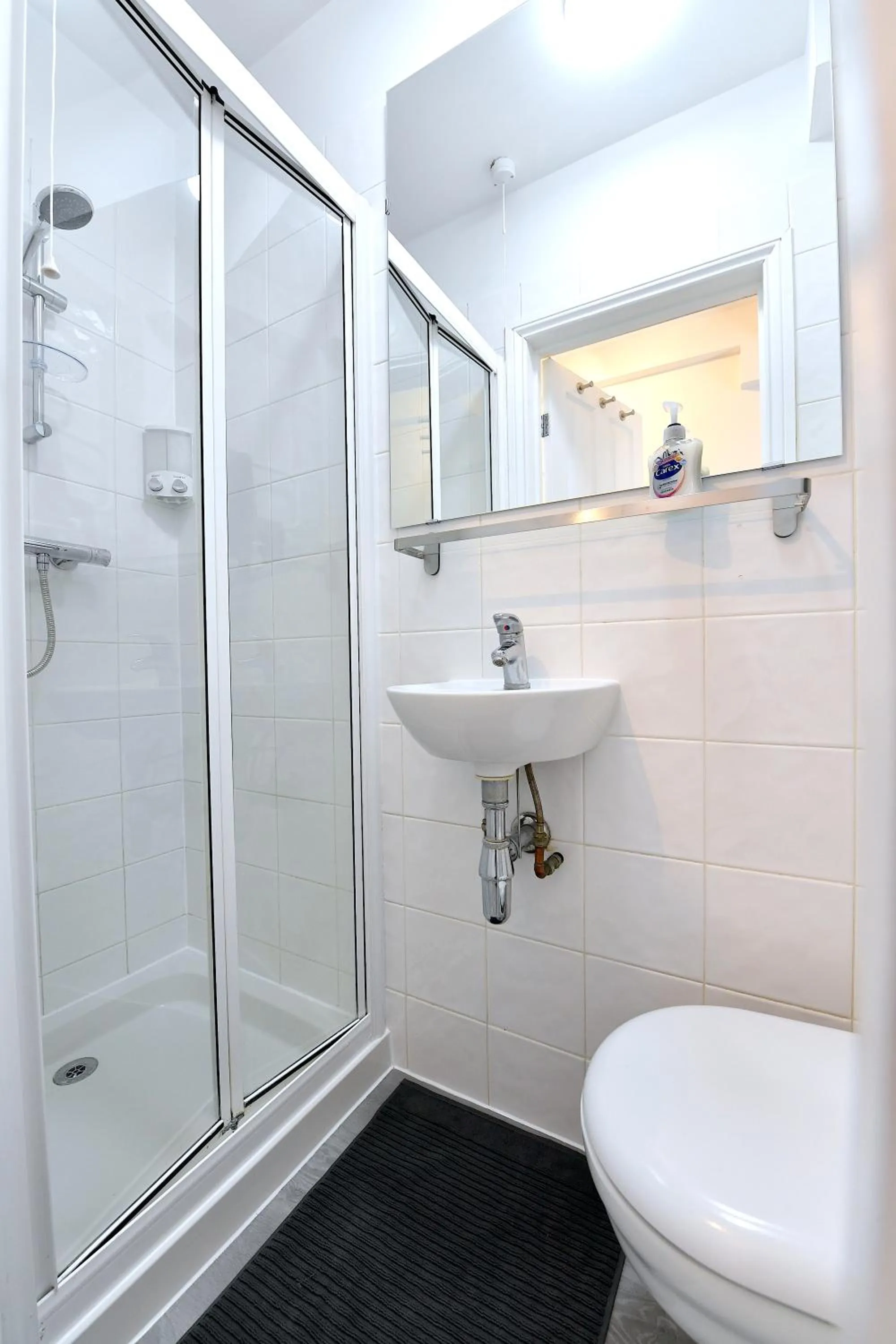 Shower in Stylish Studios by Luxestays Fulham