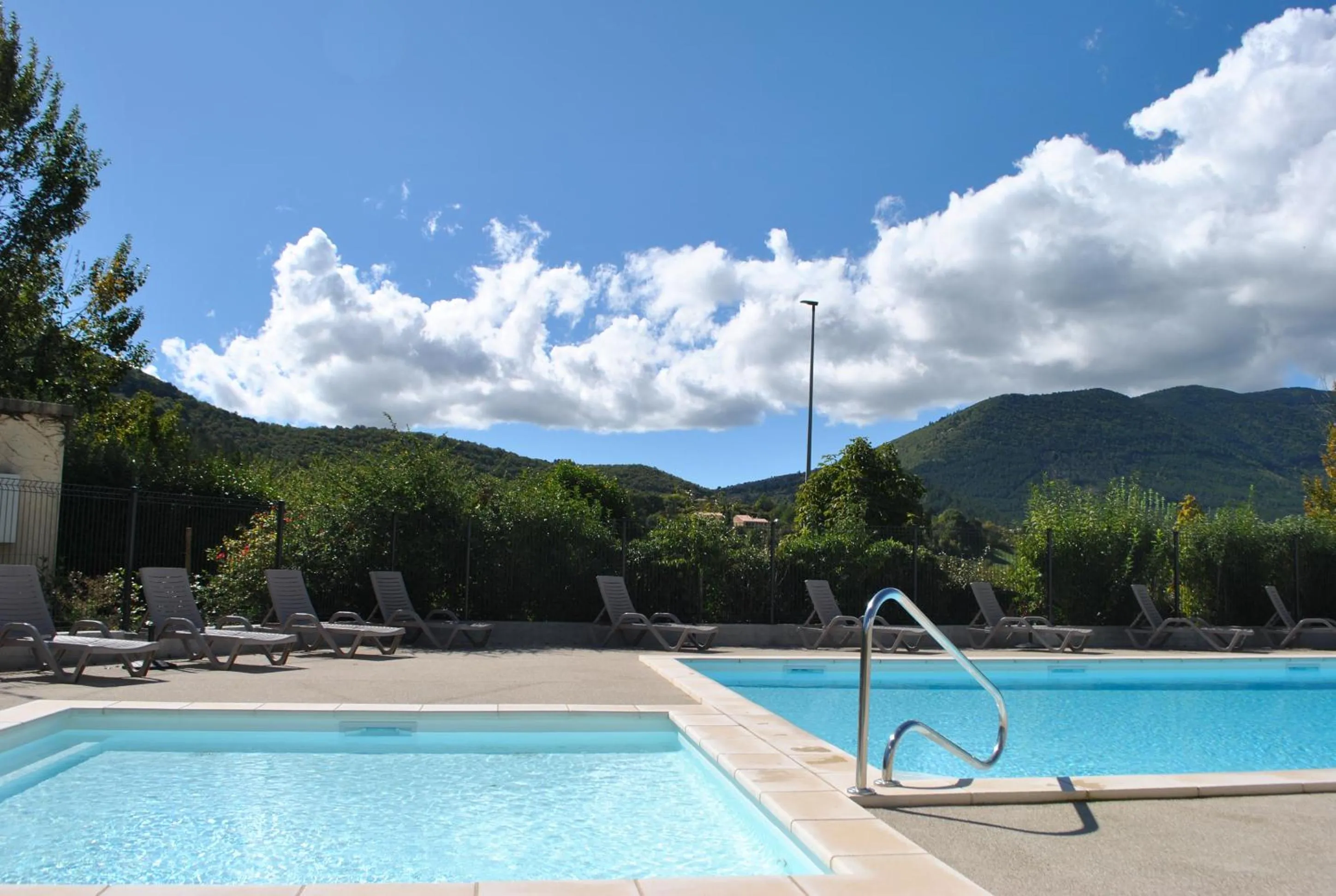 Swimming pool in Le Hameau des Sources by Ateya