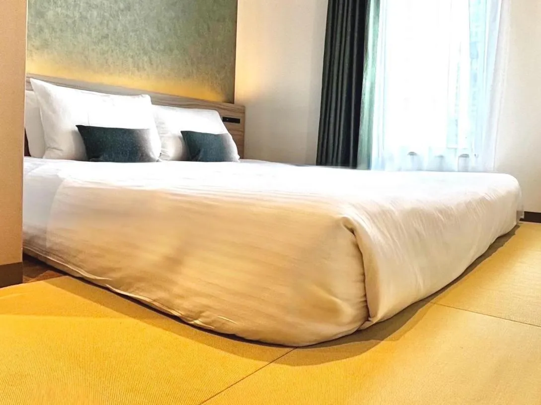 Photo of the whole room, Bed in HOTEL AMANEK Shinjuku Kabukicho