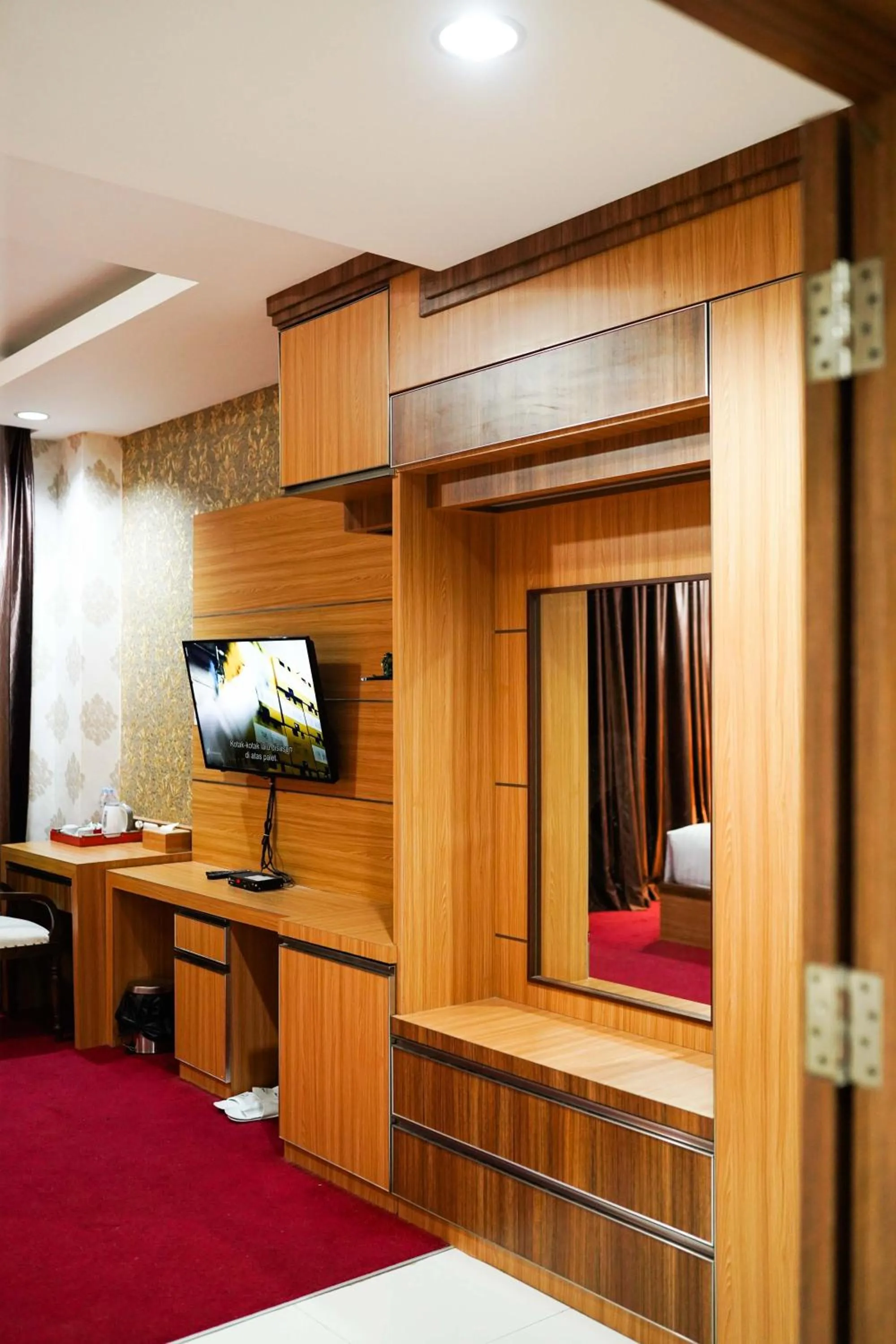 Bed in Grand Buana Lestari Hotel