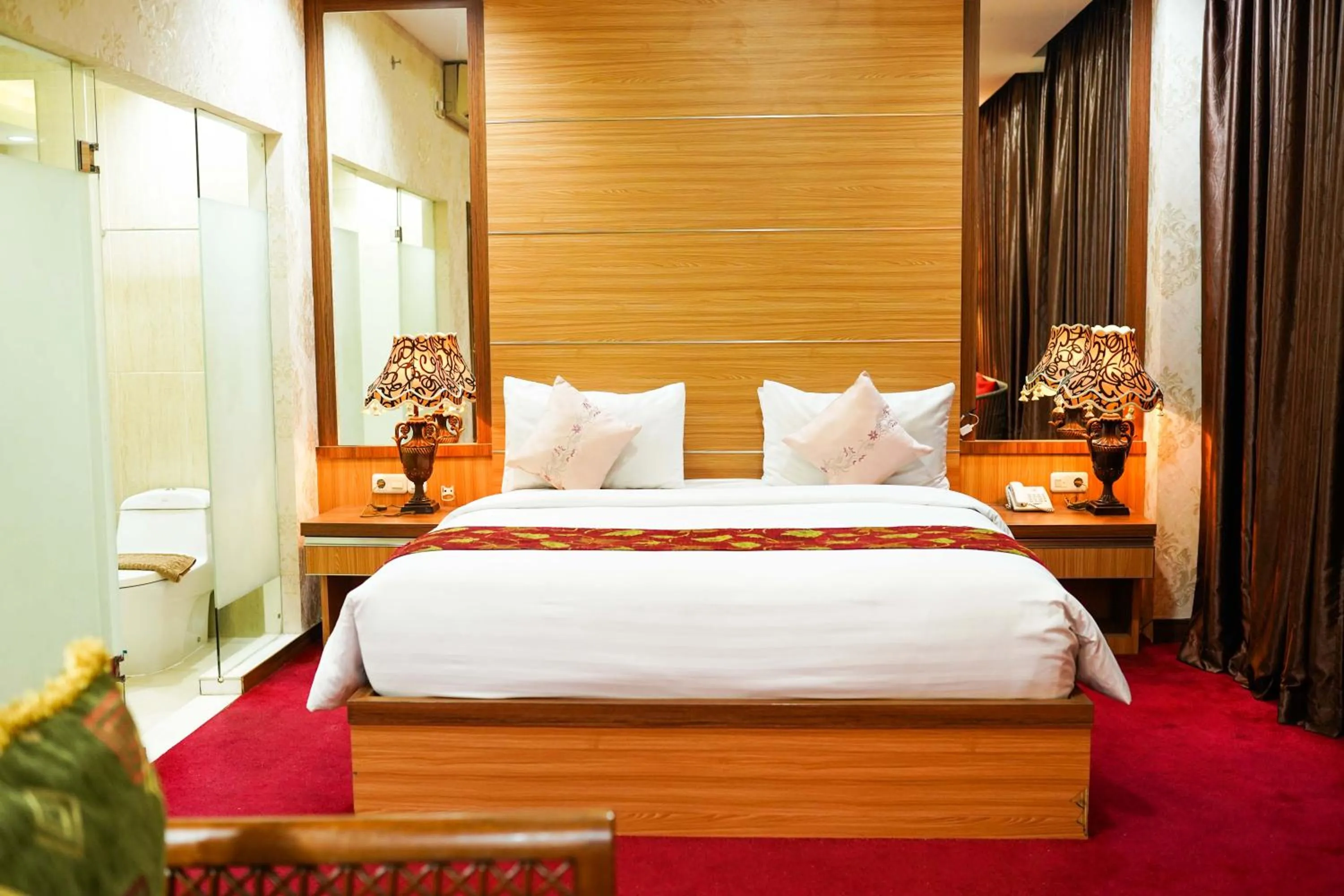 Bed in Grand Buana Lestari Hotel