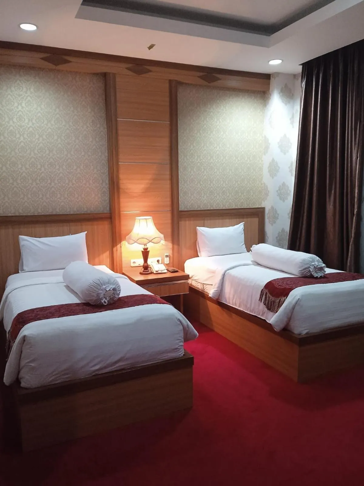 Bed in Grand Buana Lestari Hotel