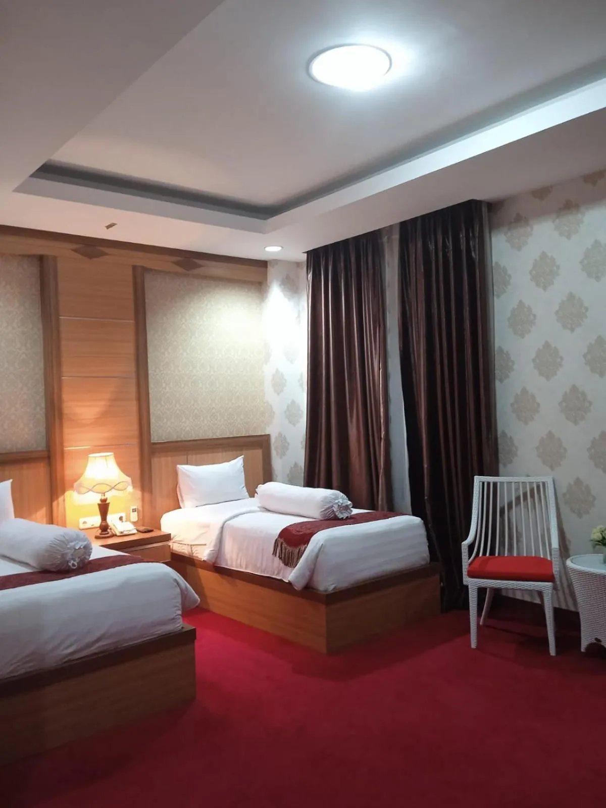 Bed in Grand Buana Lestari Hotel