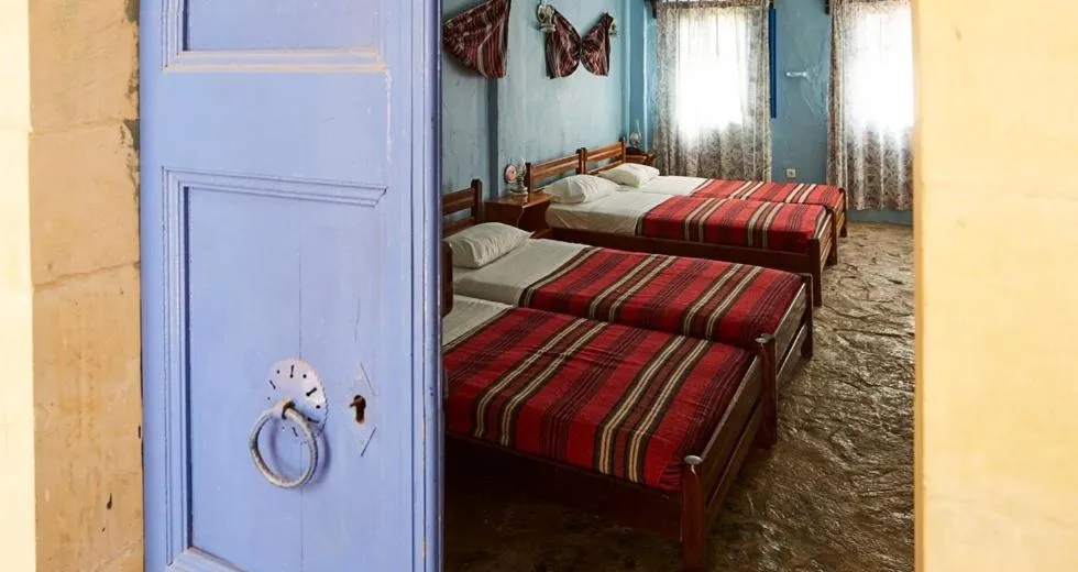 Bed in Arolithos Traditional Village Hotel