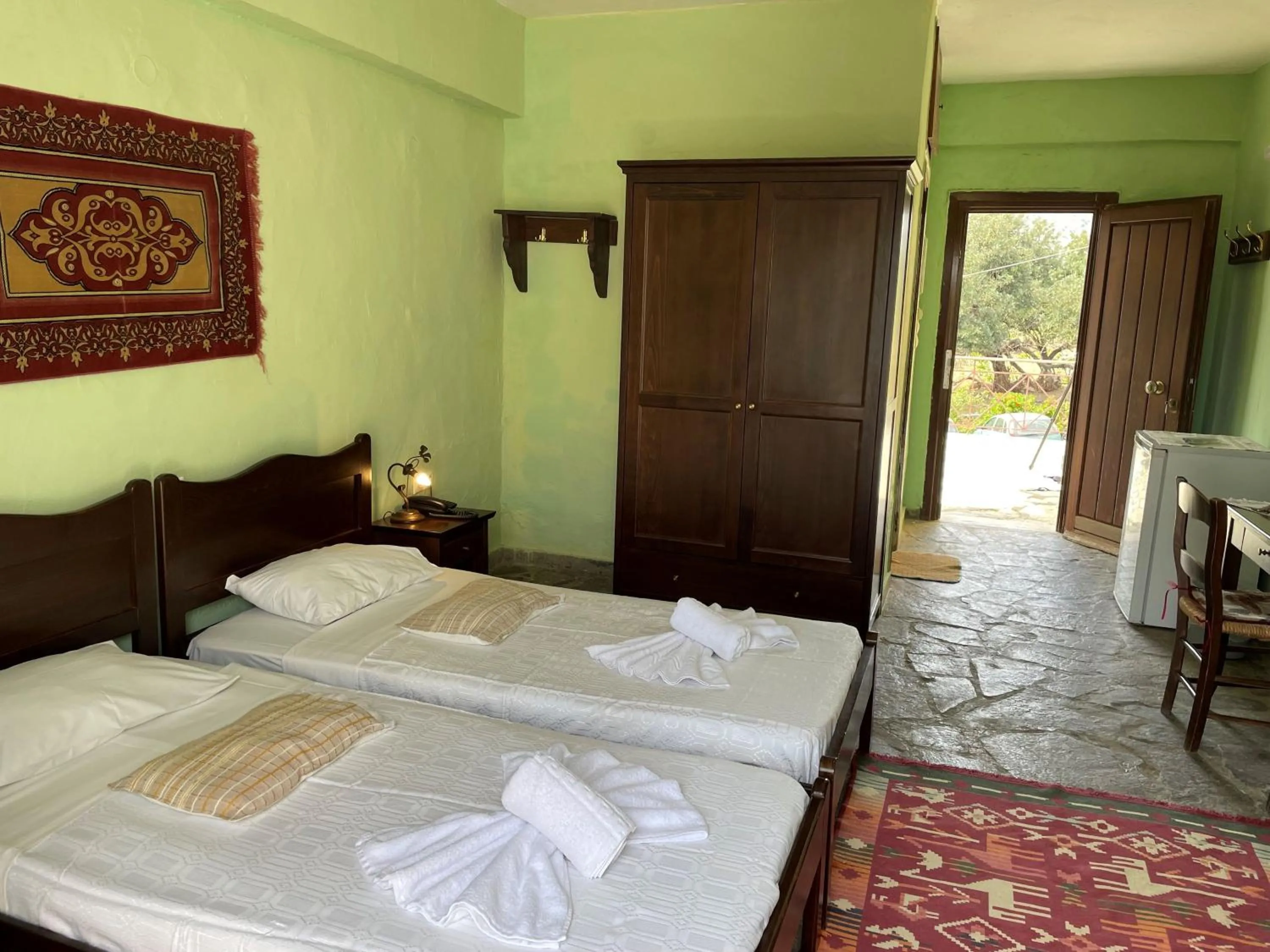 Bed in Arolithos Traditional Village Hotel