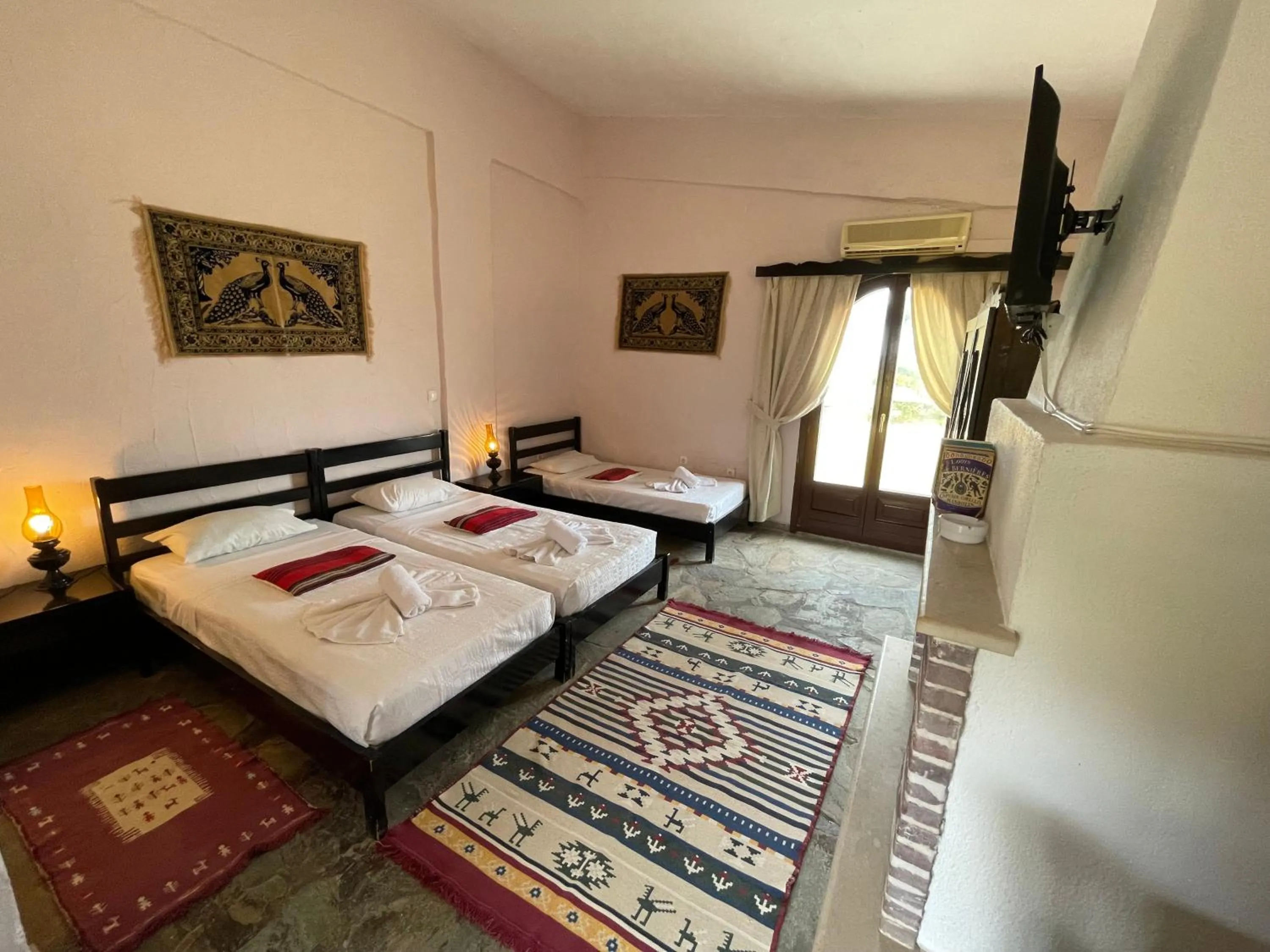 Bed in Arolithos Traditional Village Hotel