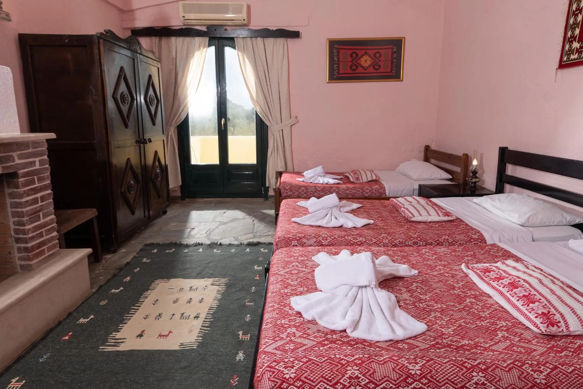 Bed in Arolithos Traditional Village Hotel