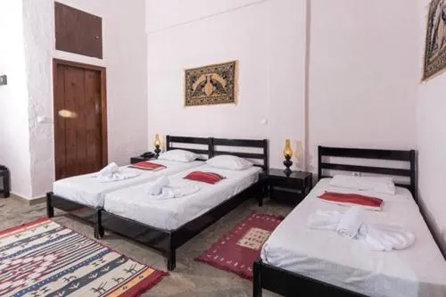 Bed in Arolithos Traditional Village Hotel