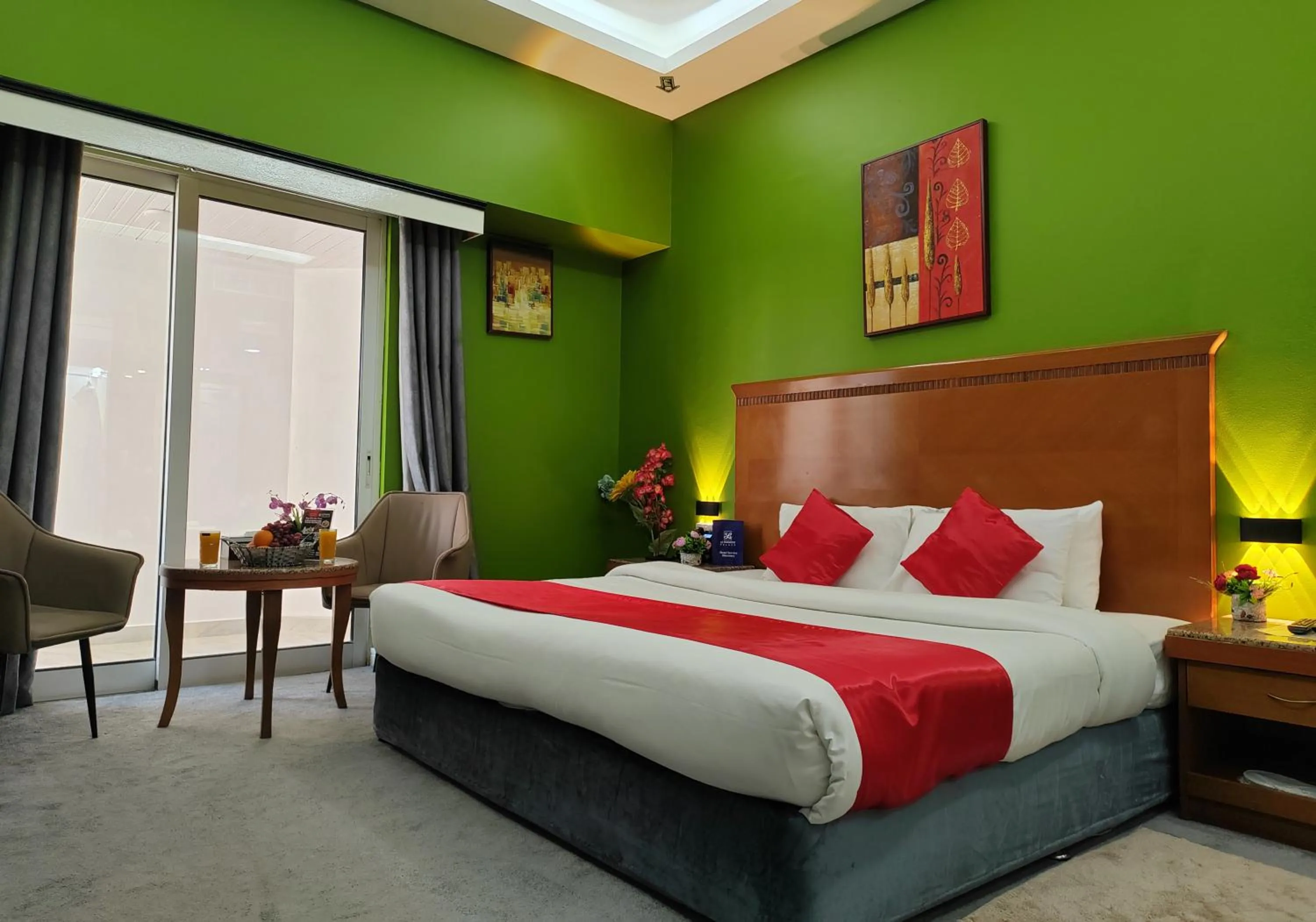 Seating area, Bed in Le Paradise Palace Hotel Deira Dubai Al Rigga