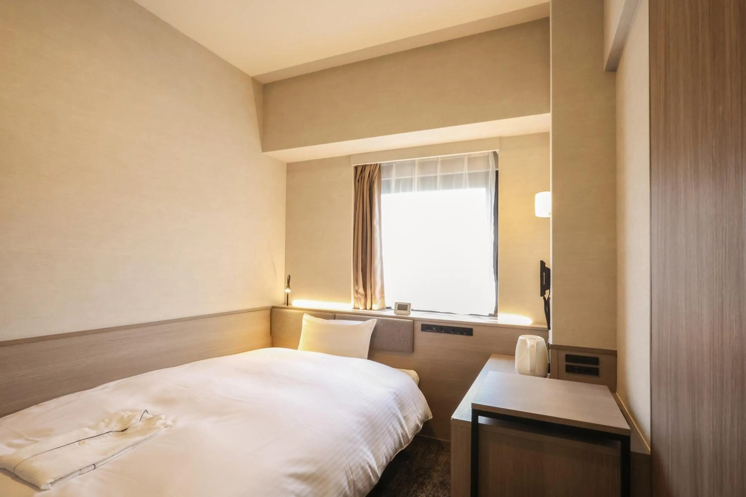 Bed in SK HOTEL Kobe Ekimae