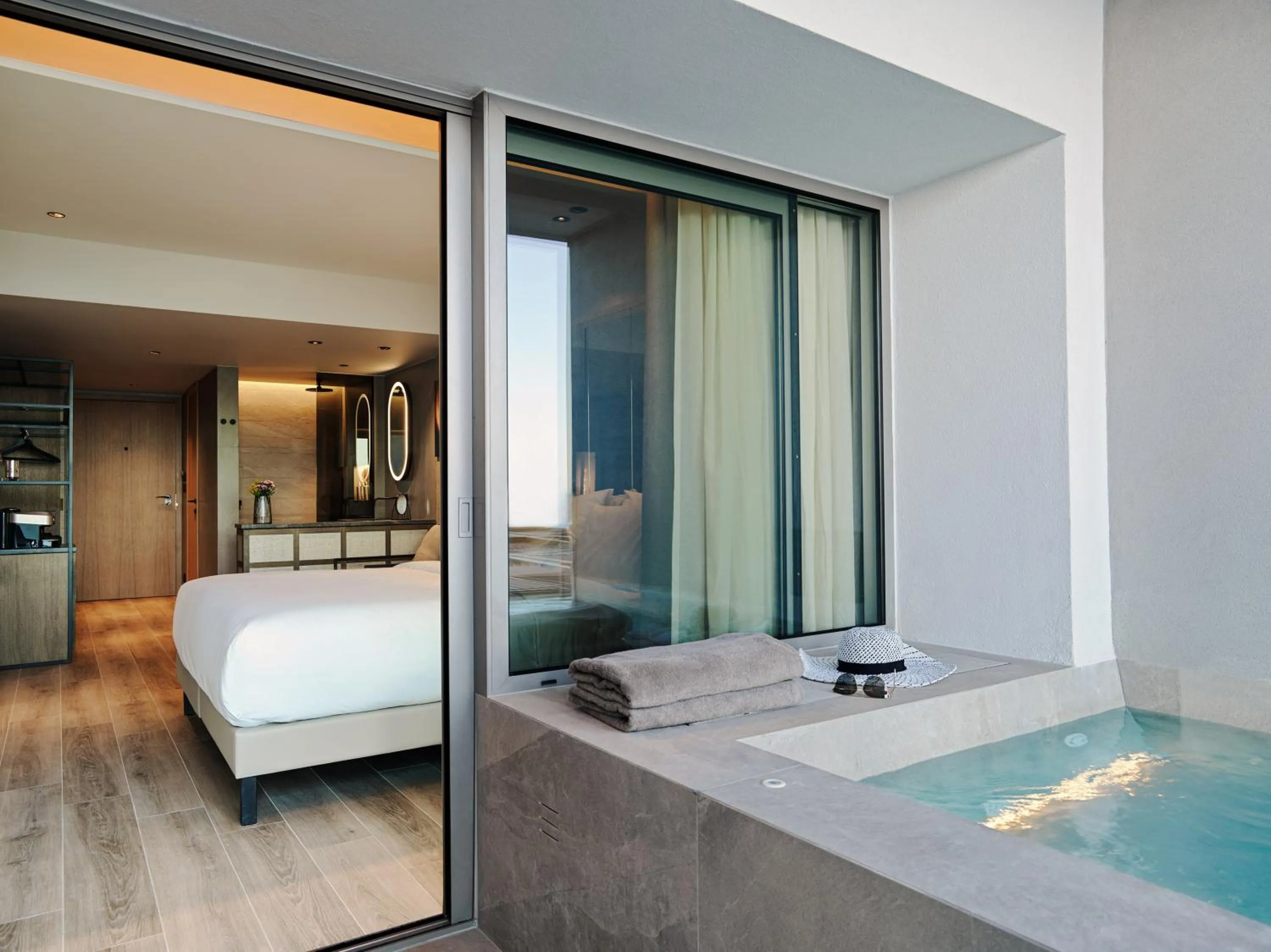 Photo of the whole room, Bed in NIKO Seaside Resort MGallery