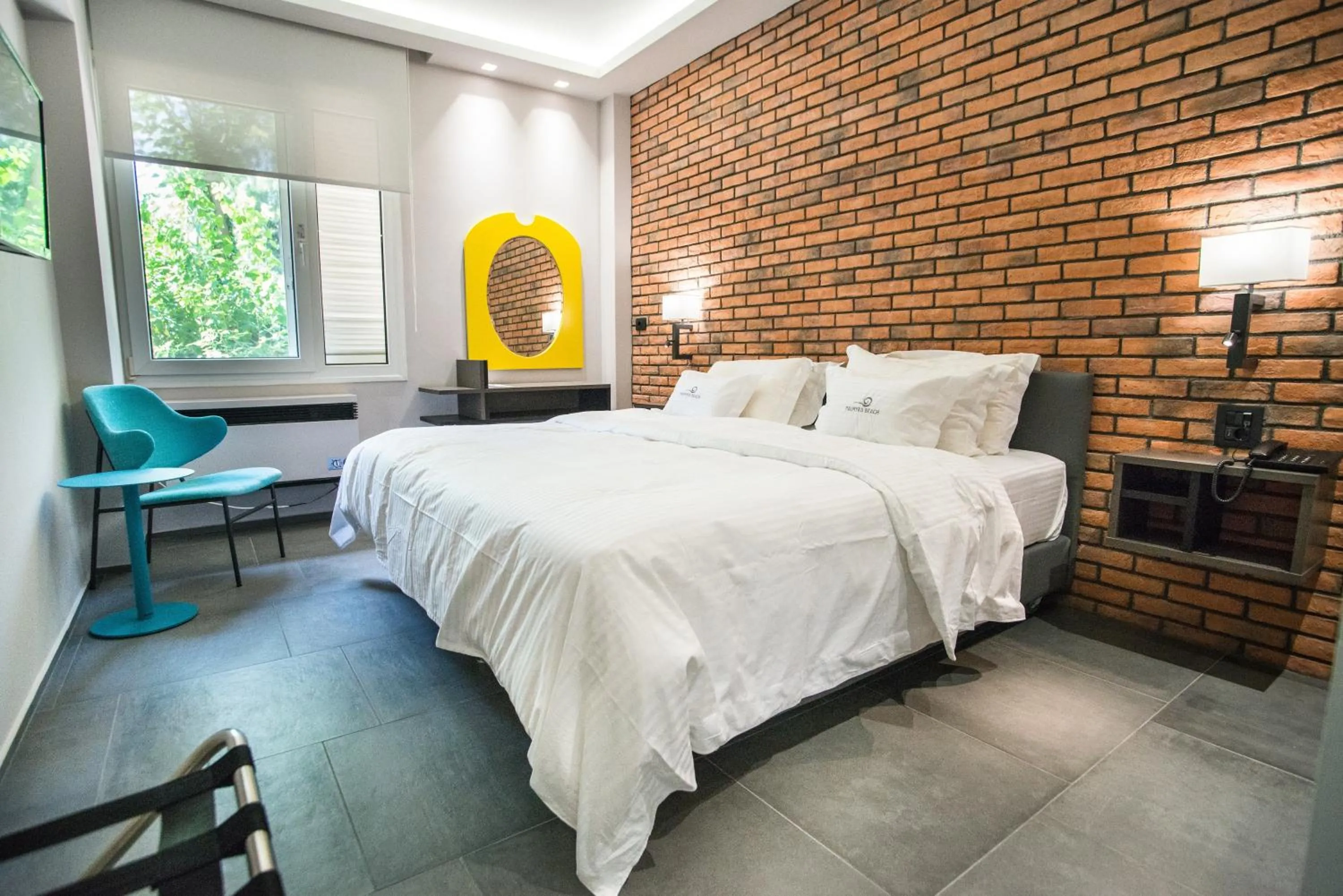 Bed in Palmyra Beach Hotel