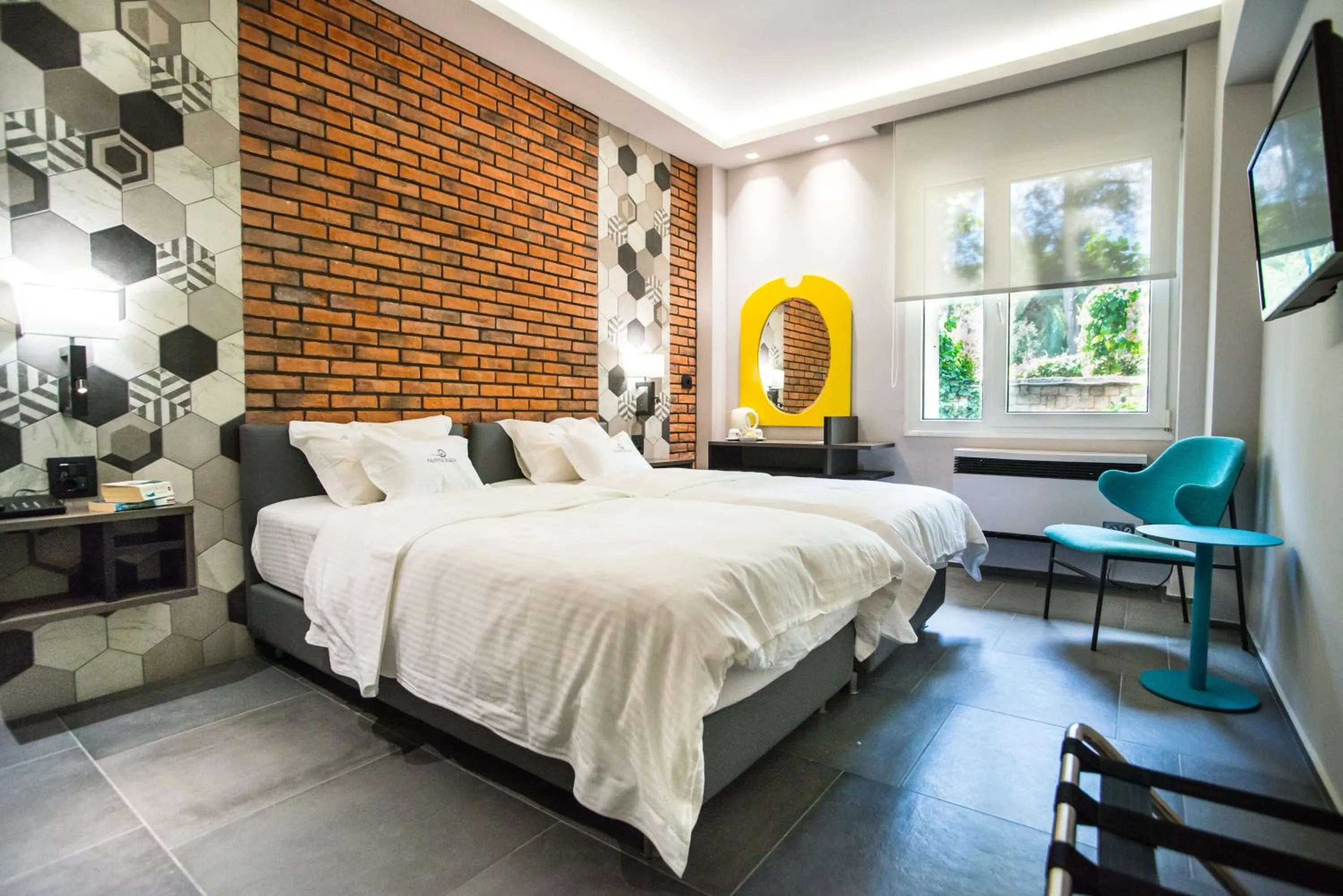 Bed in Palmyra Beach Hotel