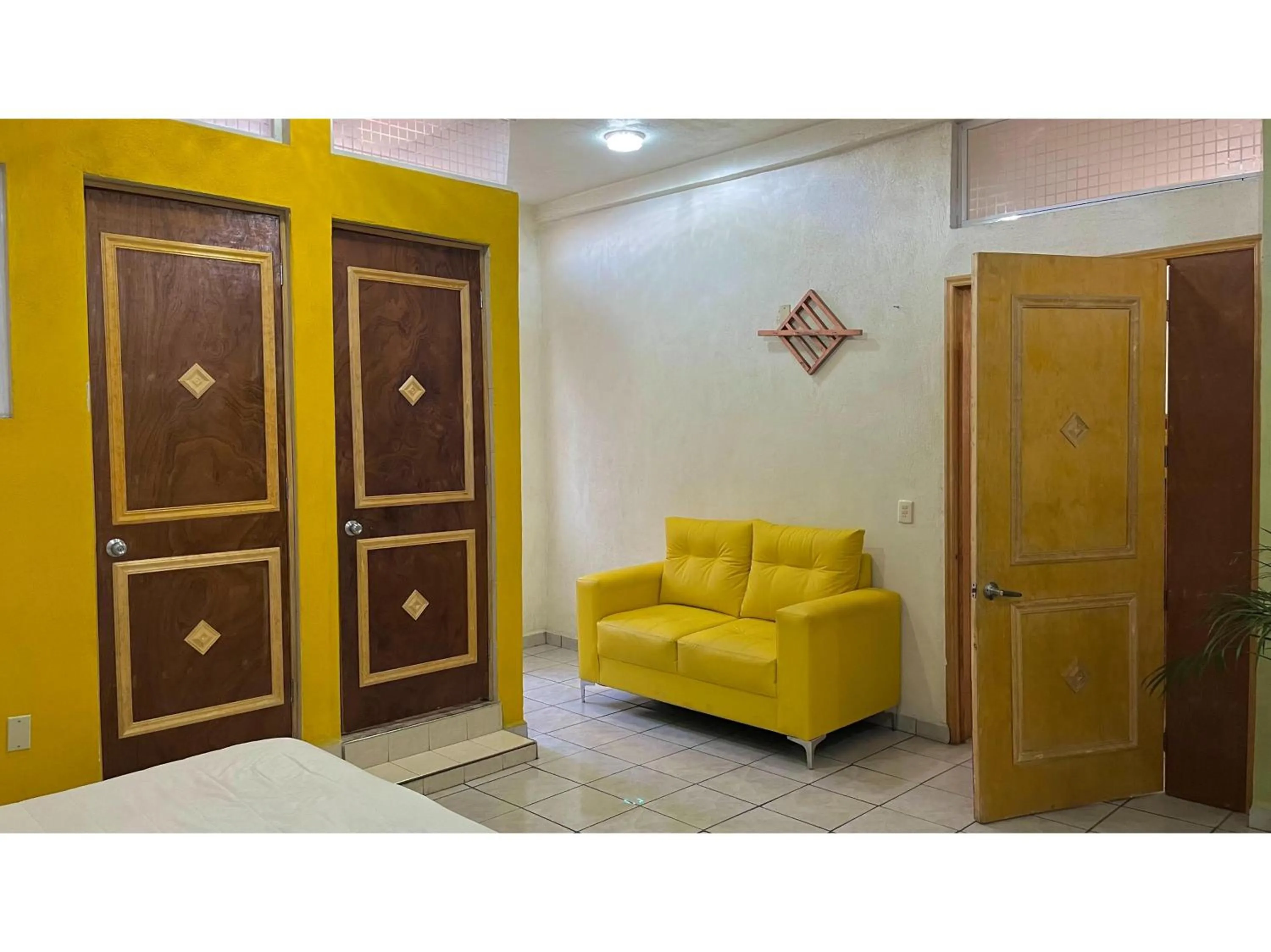 Bedroom in OYO Hotel Museo Carnaval