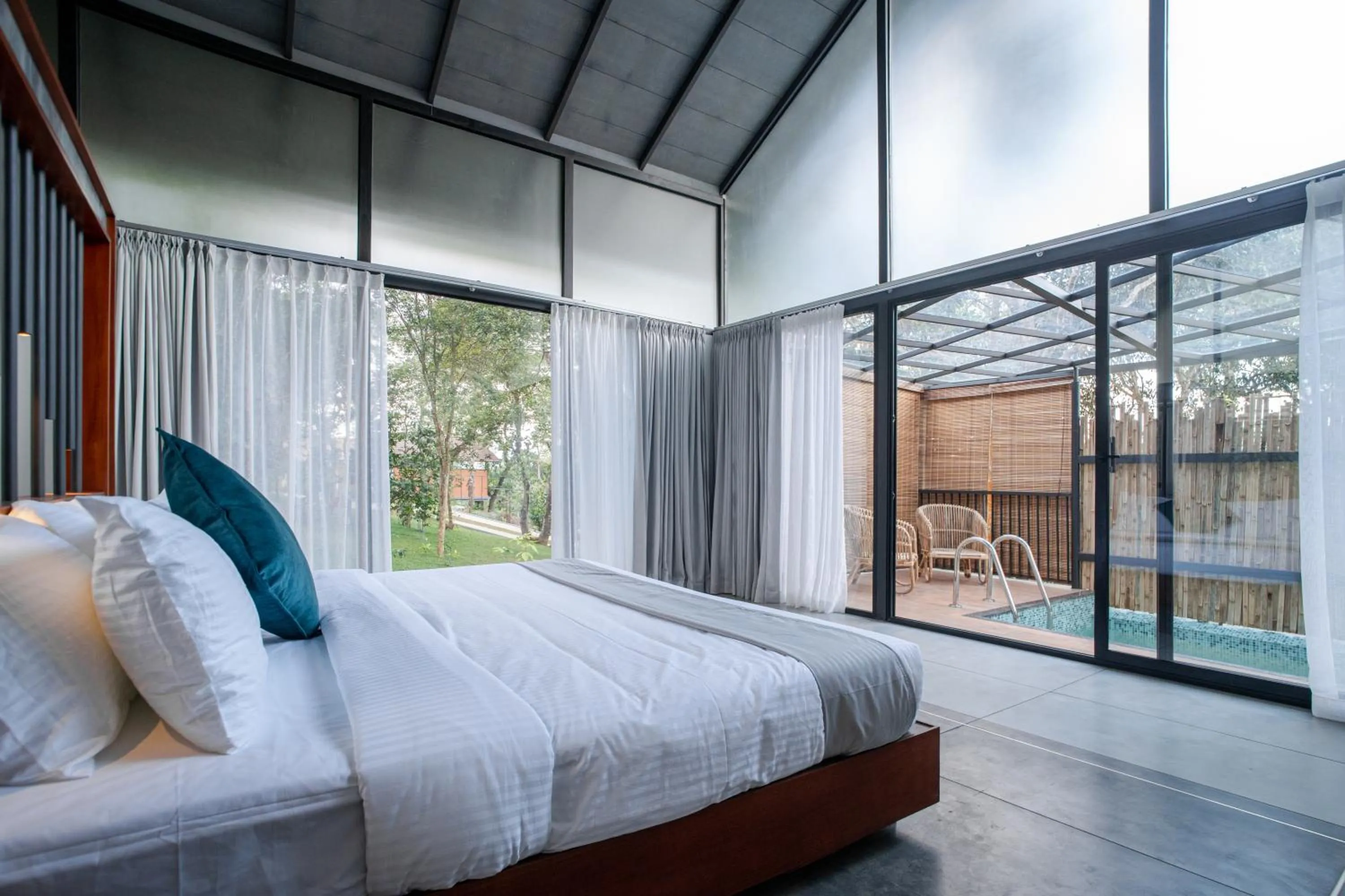 Bed in Crystal Kuruva Nature Resort & Spa