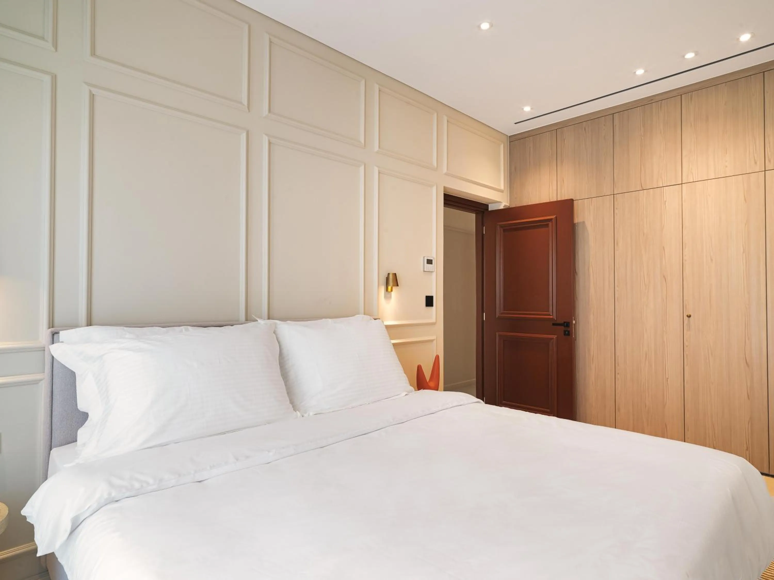 Bedroom, Bed in LIV Mackenzie Beach Suites Larnaca ADULTS ONLY