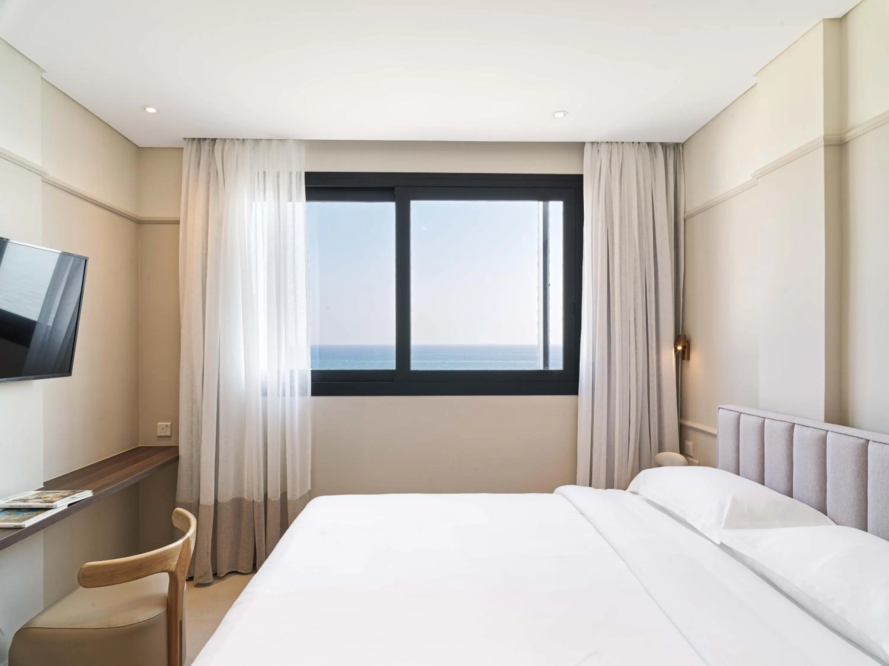Bed in LIV Mackenzie Beach Suites Larnaca ADULTS ONLY