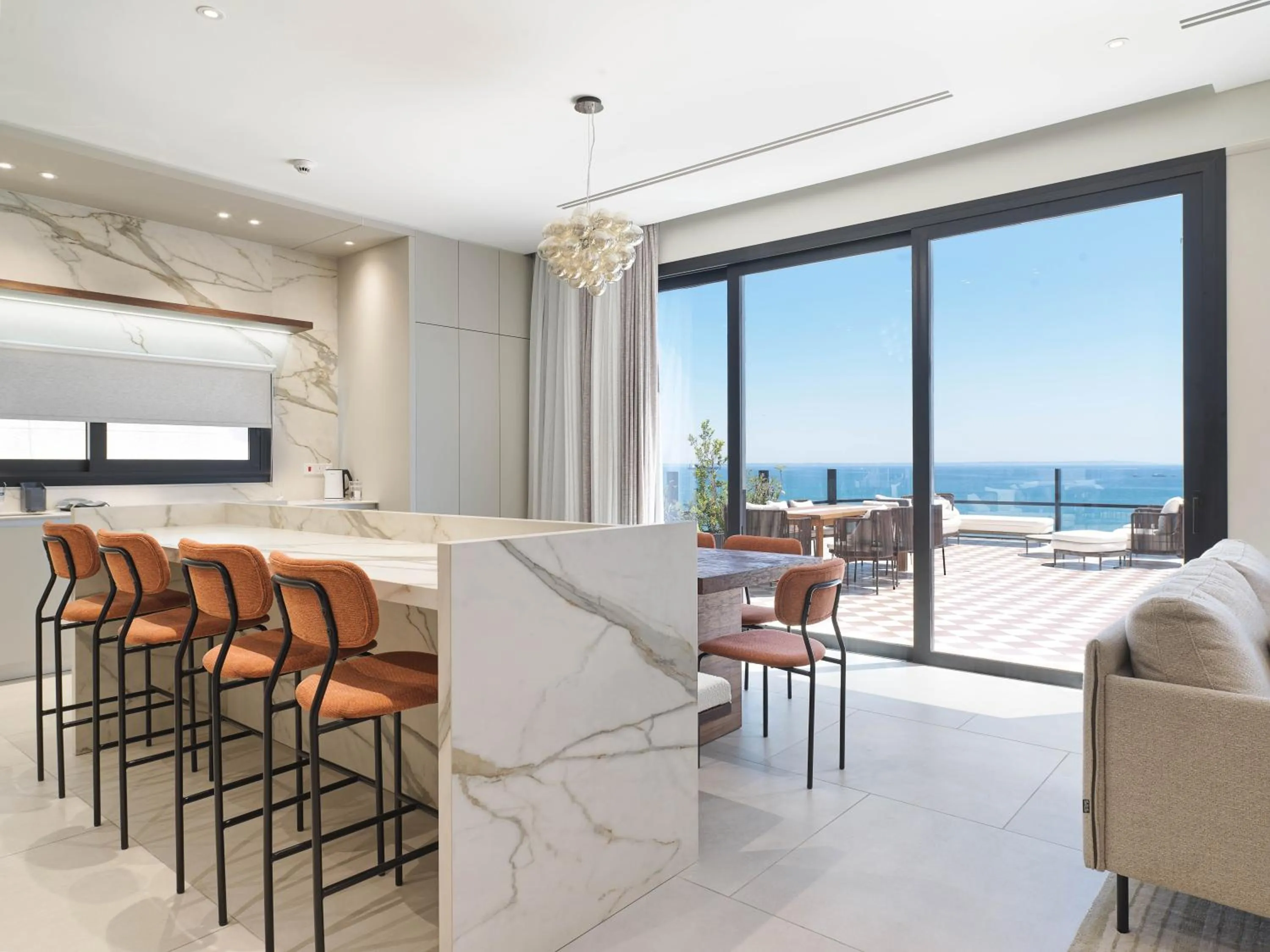 Seating area in LIV Mackenzie Beach Suites Larnaca ADULTS ONLY