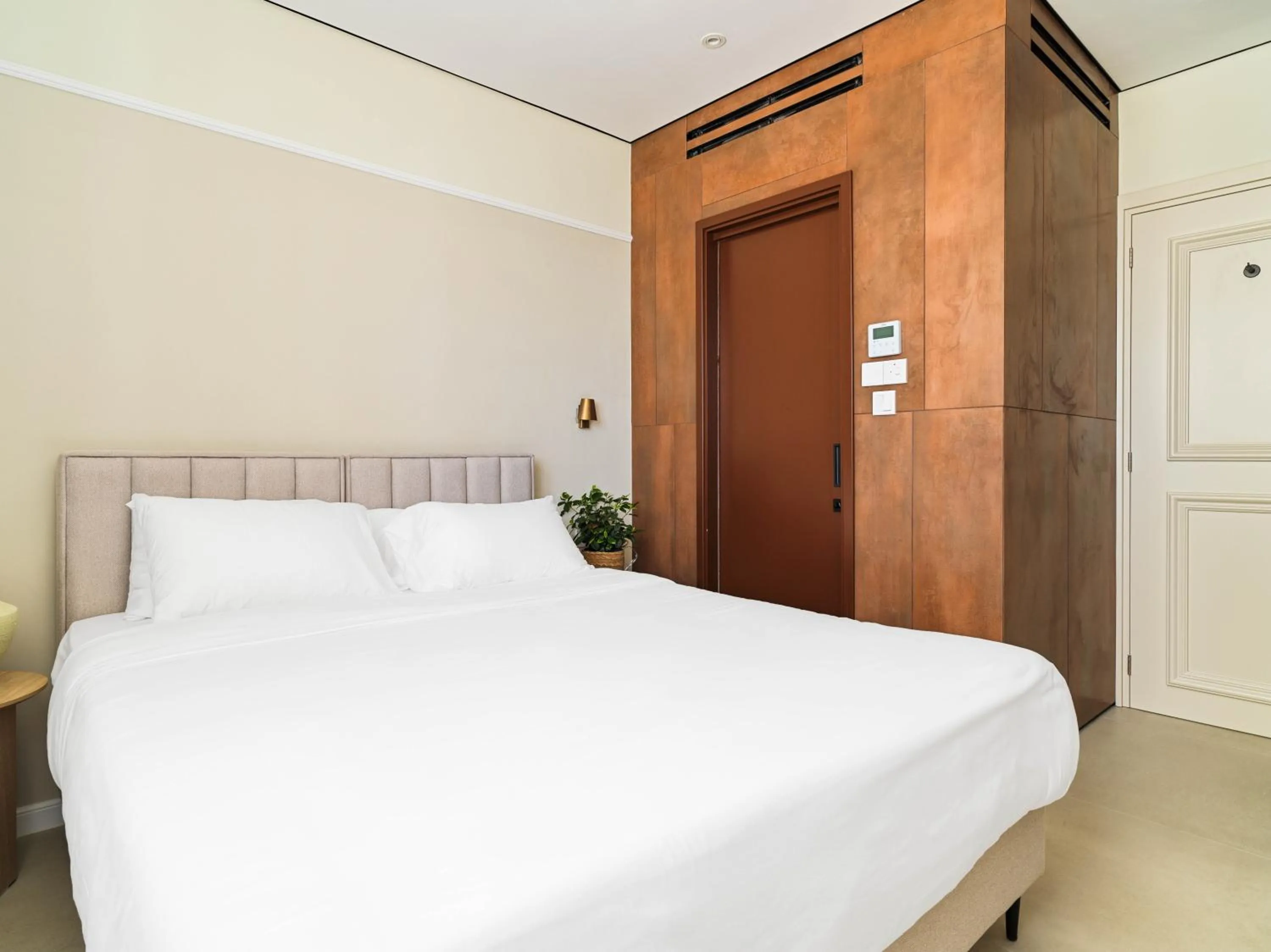 Bed in LIV Mackenzie Beach Suites Larnaca ADULTS ONLY