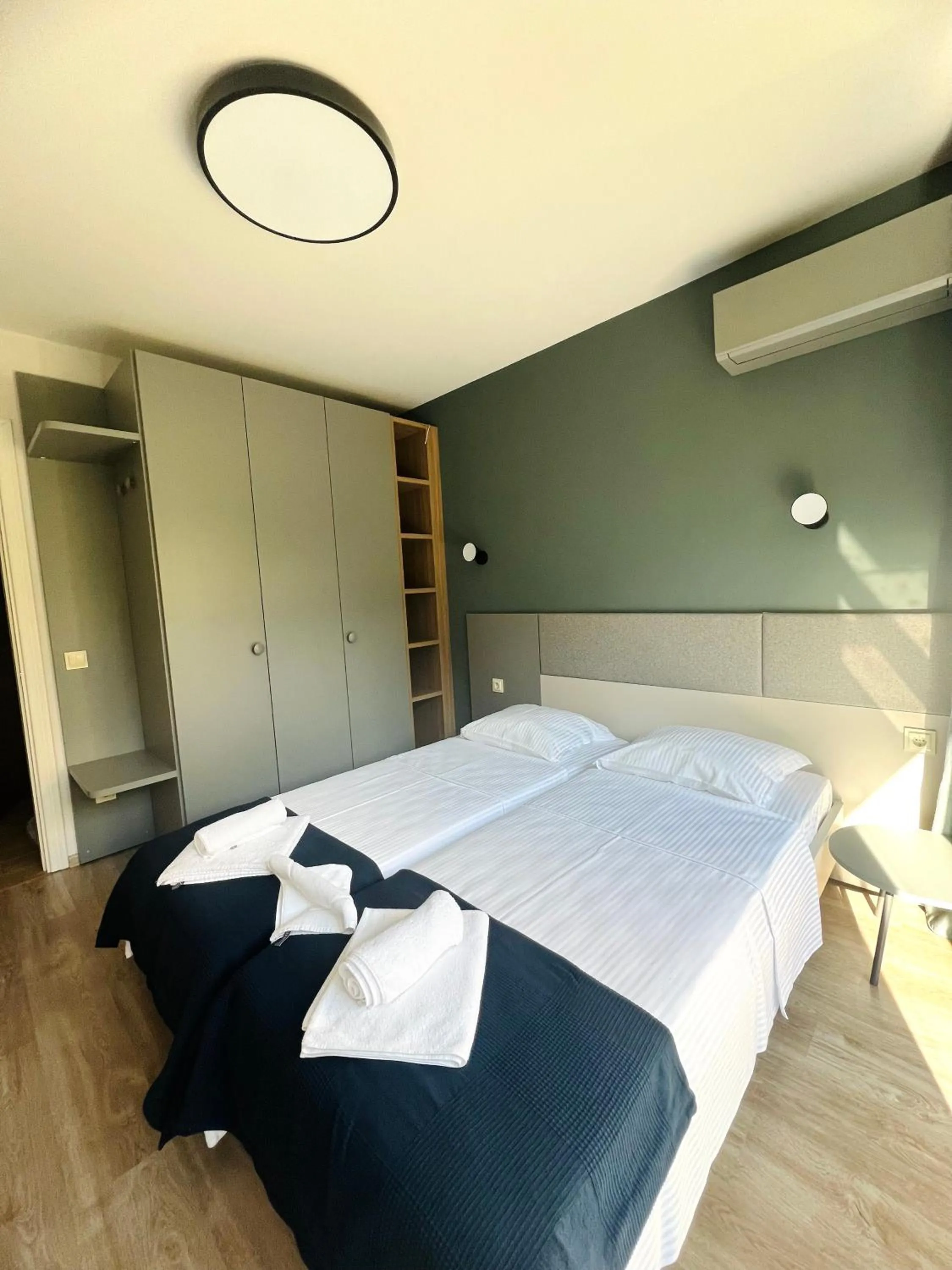 wardrobe, Bed in 7th Sense boutique apartments